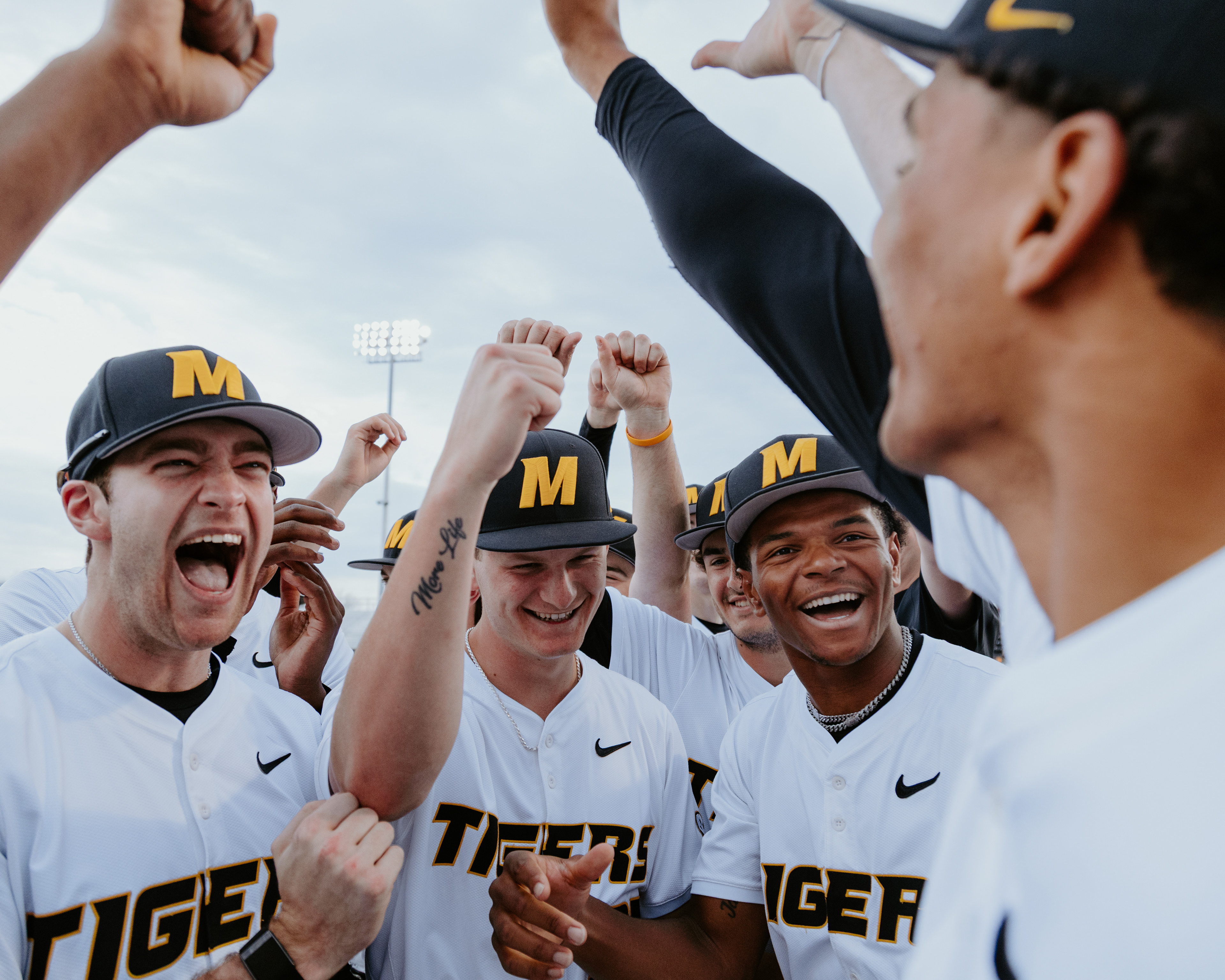 From left, Nic Smith, Luke Fricker and Chris Patterson laugh at a joke during a pregame team huddle at Taylor Stadium on March 6, 2026, in Columbia, Missouri.