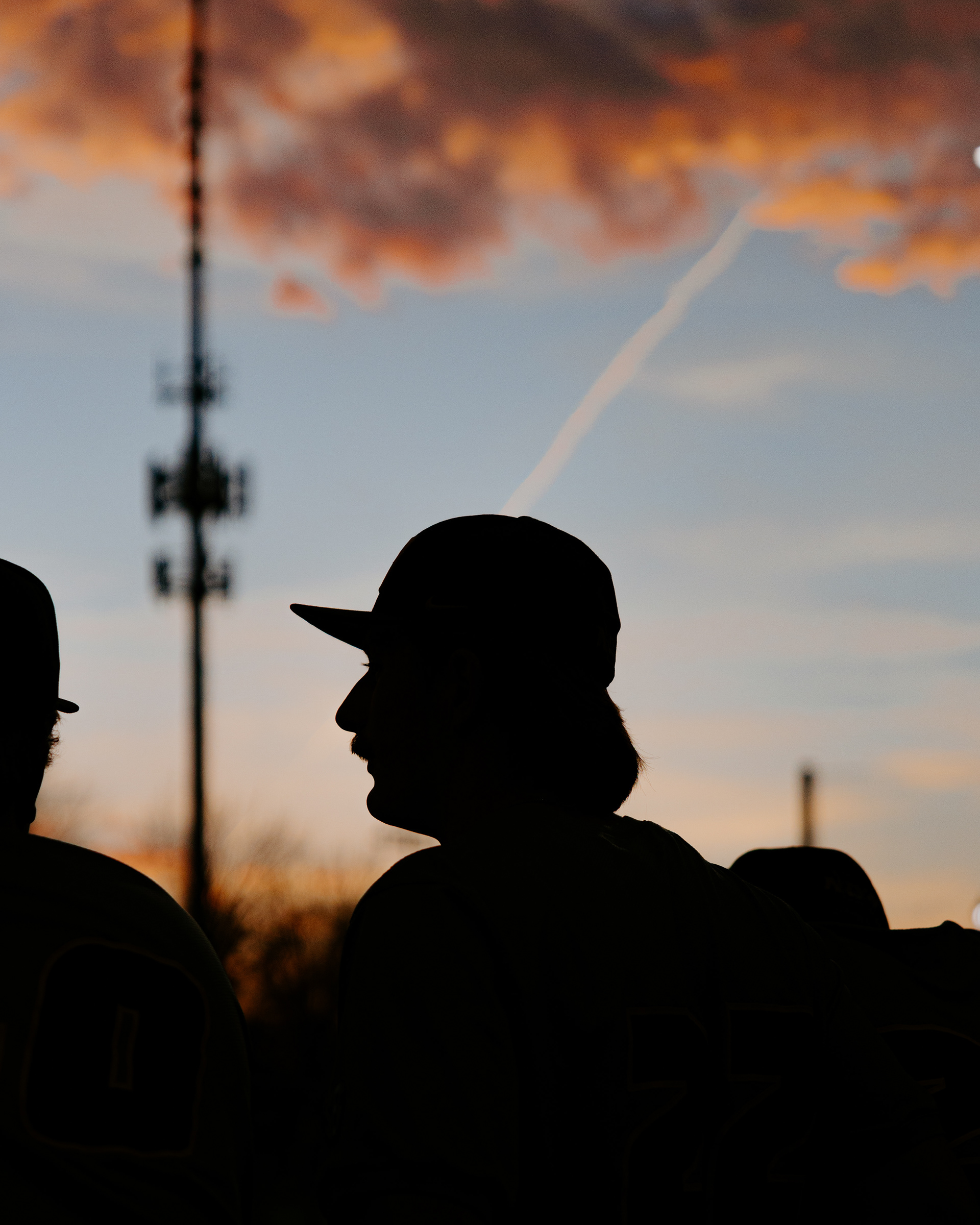 Kadden Drew watches a baseball game as the sun sets at the Lou Brock Sports Complex on March 25, 2026, in St. Charles, Missouri.
