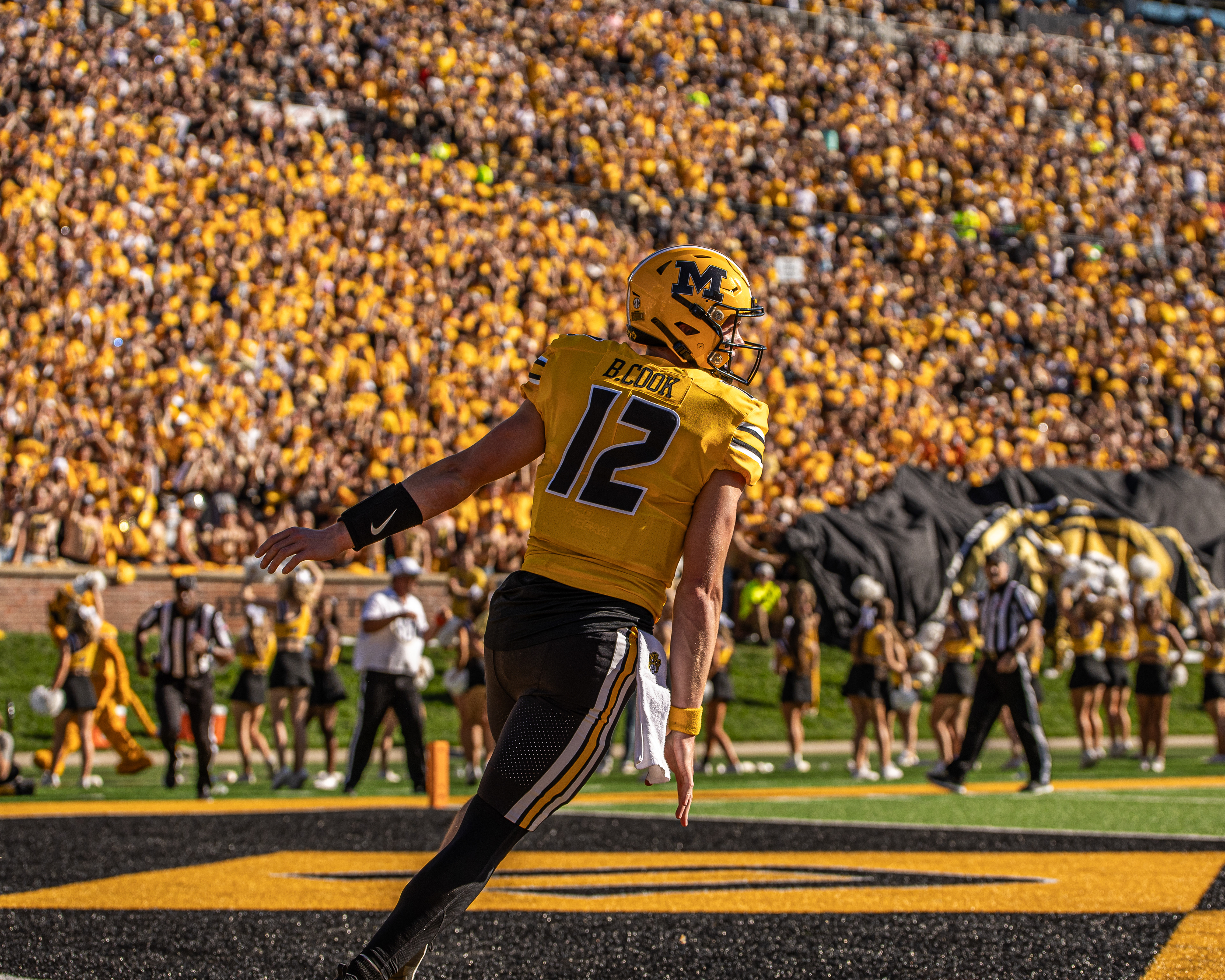 Mizzou quarterback Brady Cook (12) celebrates after scoring a 17-yard rushing touchdown at Memorial Stadium on Oct. 21, 2023, in Columbia, Mo.