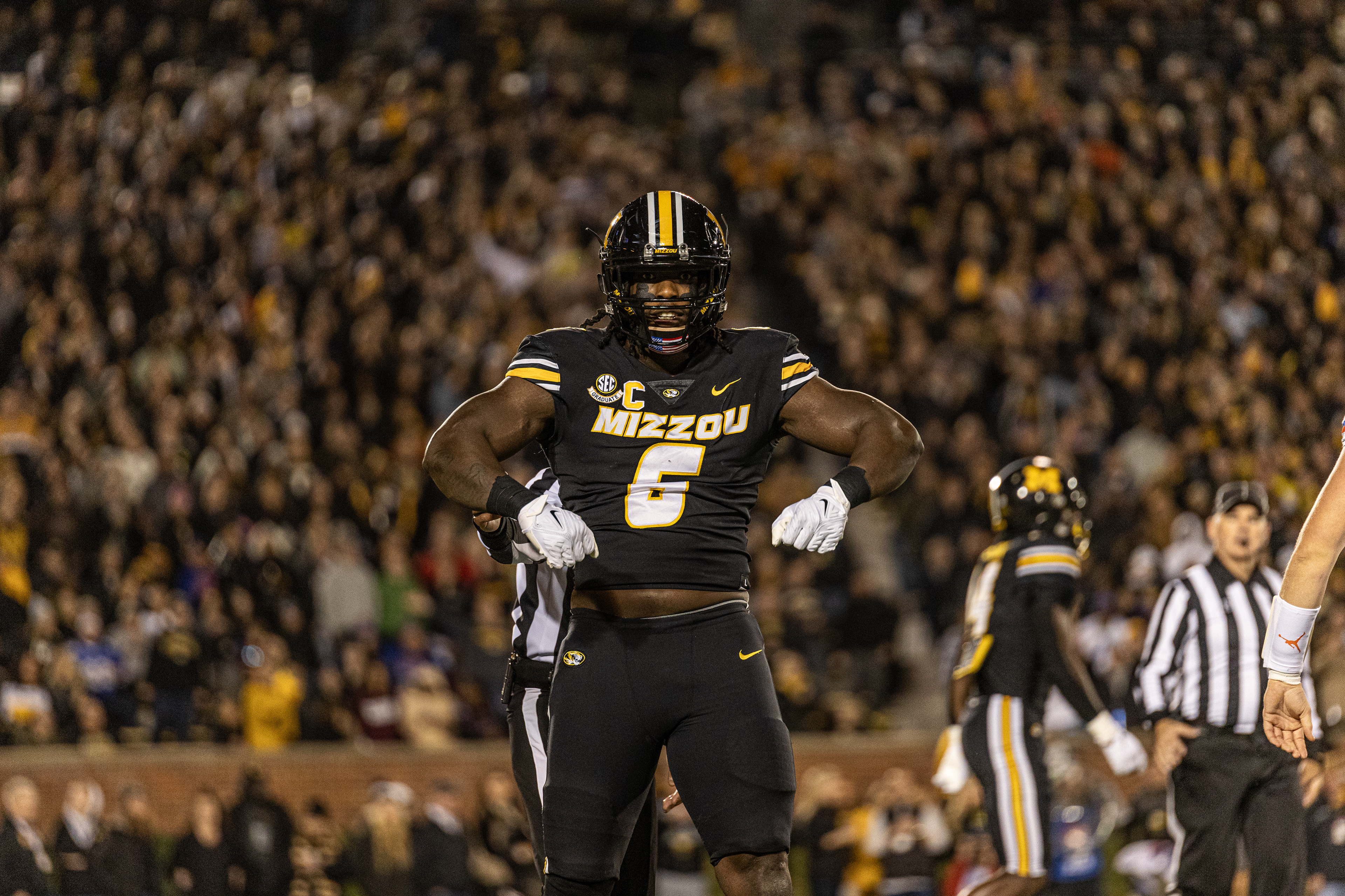 Mizzou defensive lineman Darius Robinson (6) celebrates after making a tackle at Memorial Stadium on Nov. 18, 2023, in Columbia, Mo.