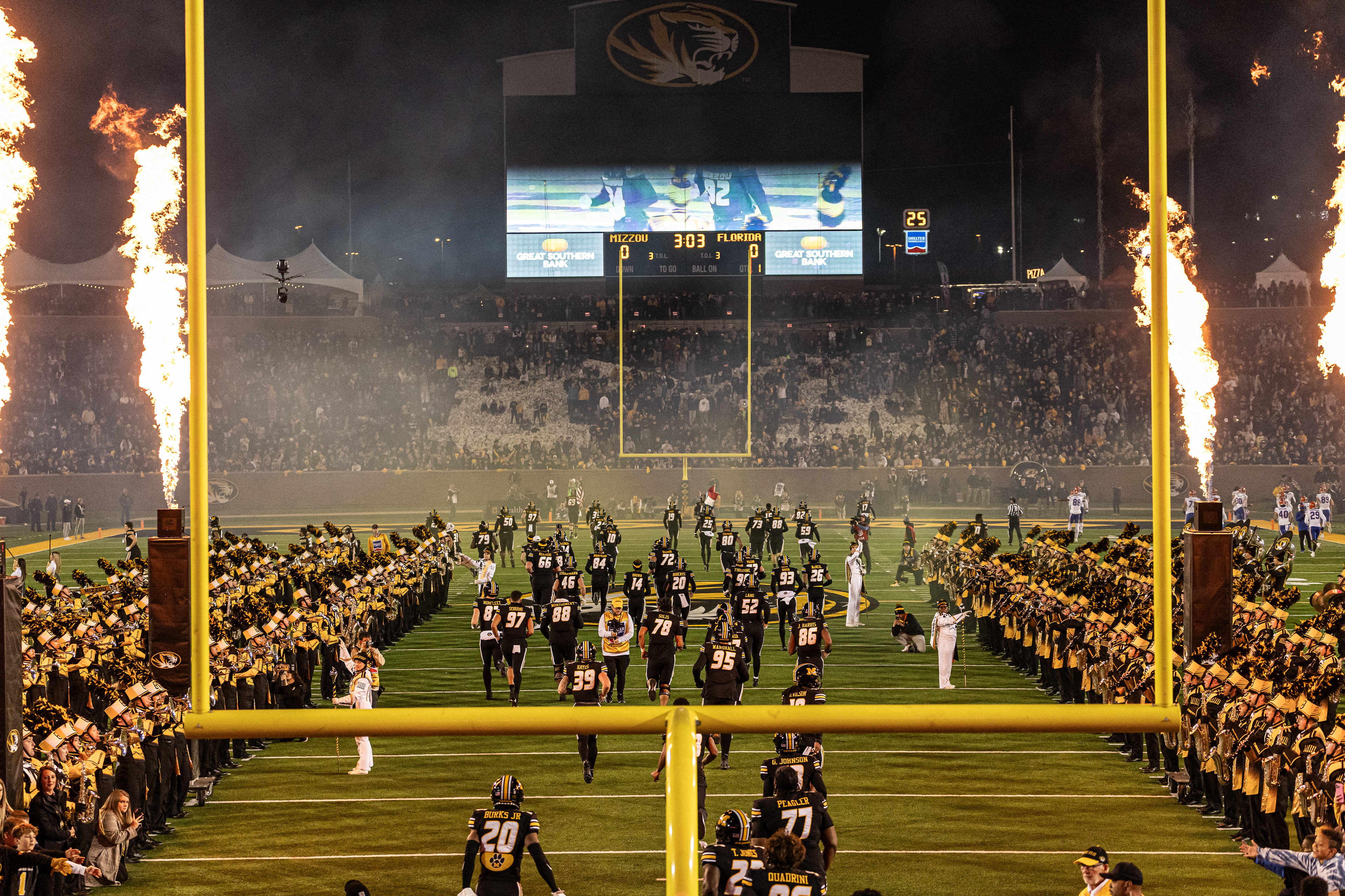 Players run out of the tunnel at Memorial Stadium on Nov. 18, 2023, in Columbia, Mo.