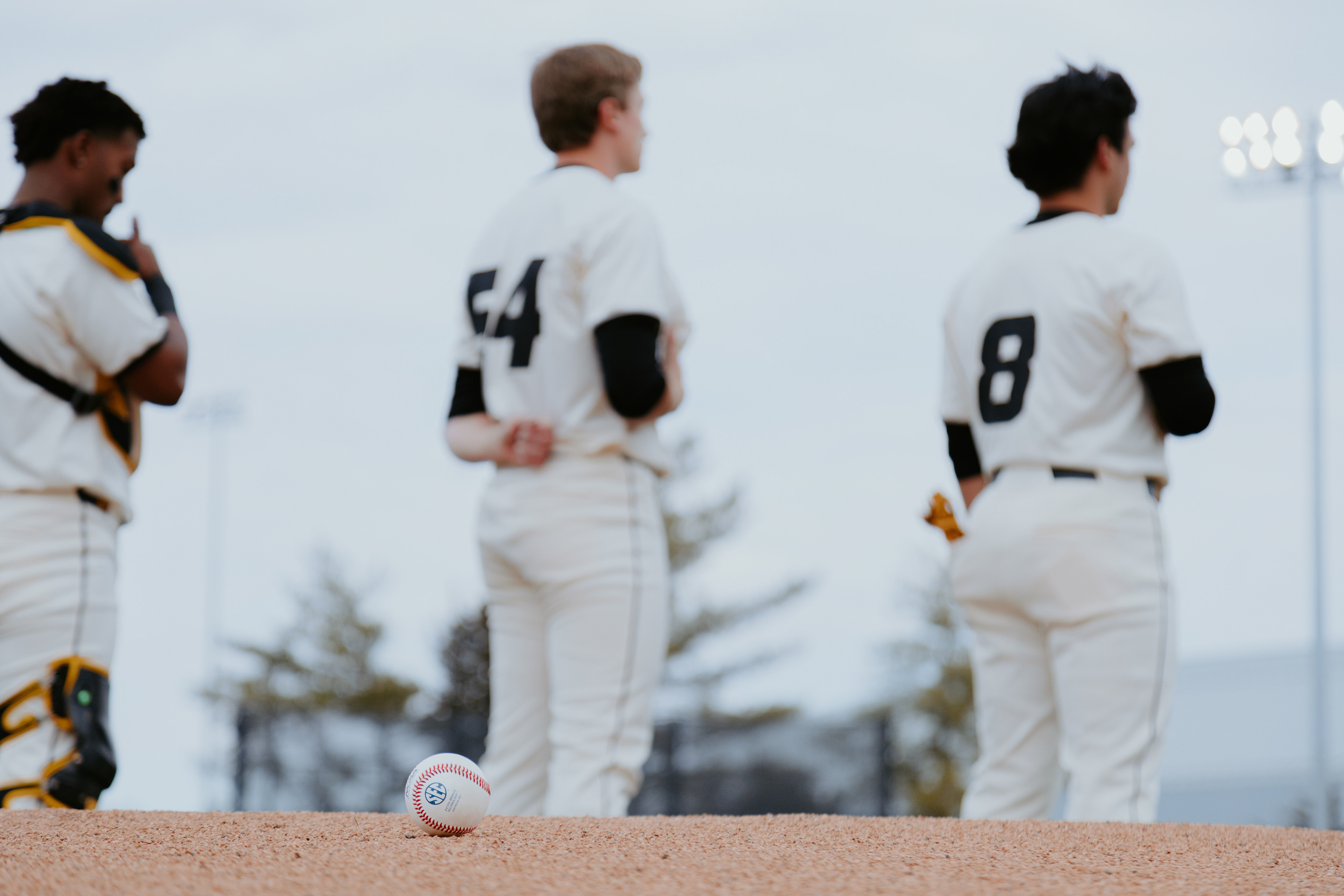From left, Jamal George, Josh McDevitt and Mateo Serna stand during the national anthem at Taylor Stadium on February 28, 2026 in Columbia, Missouri.