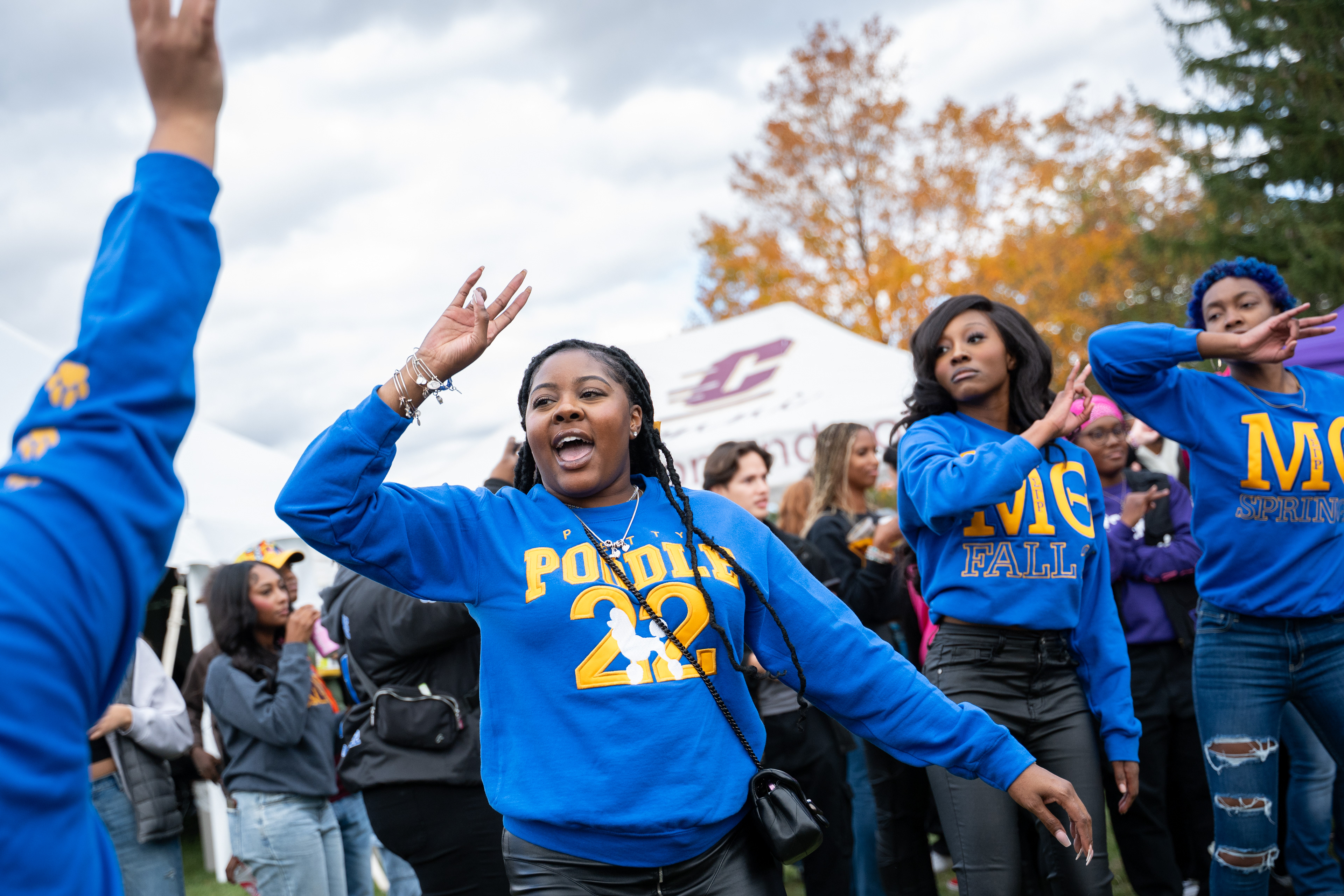 Members of the "Magificent" Mu Theta Chapter, Central Michigan's chapter of Sigma Gamma Rho Sorority, Inc., dance during the Black Alumni Tailgates at Homecoming outside of Kelly/Shorts Stadium, Saturday, Oct. 25, 2025. 