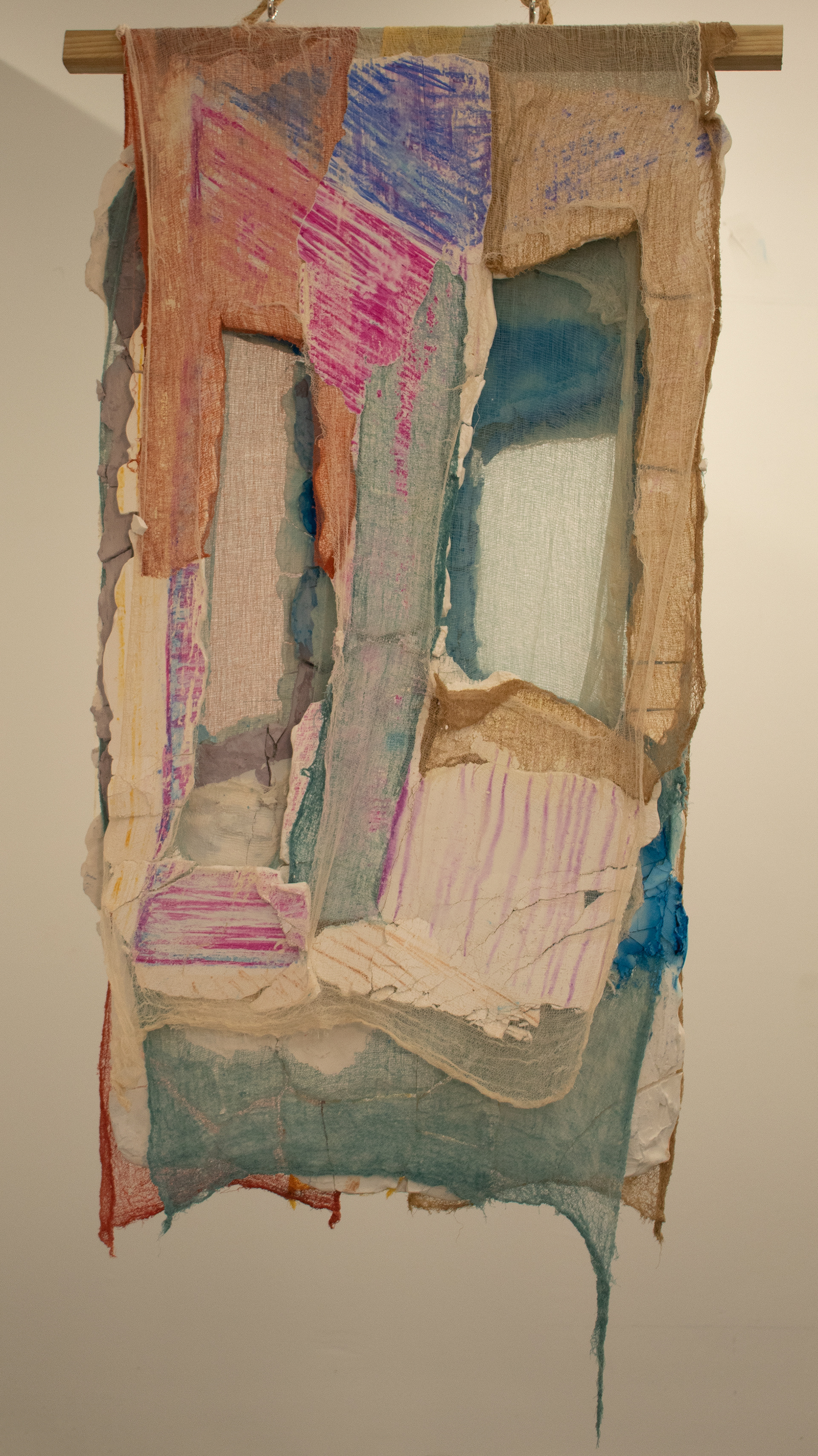 Stalling side I (2023) Hand-dyed cheesecloth, plaster, water soluble crayons, 32 x 54"