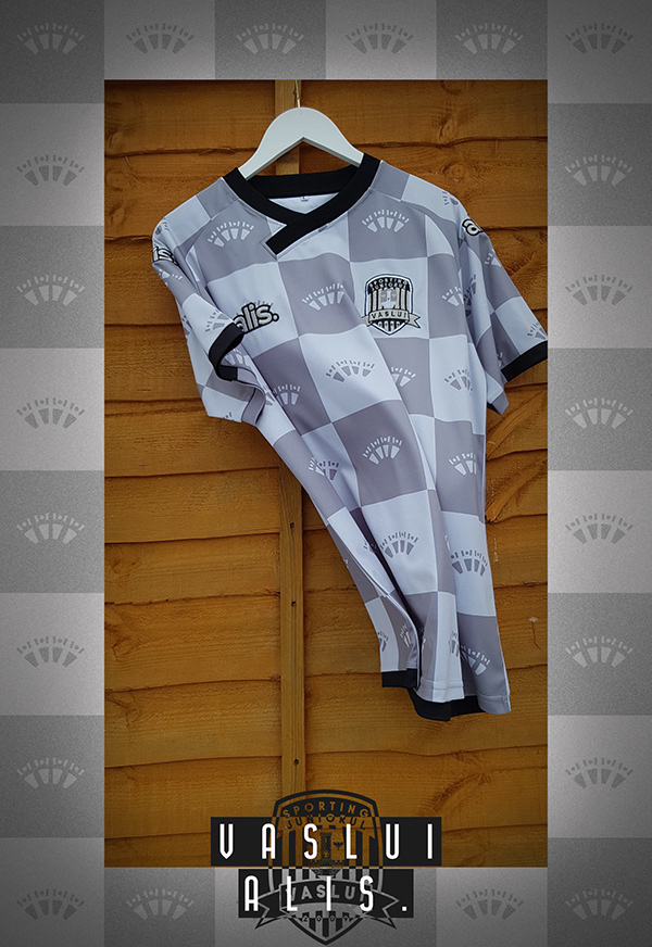 Manufactured grey checkerboard shirt hanging on a wooden wall