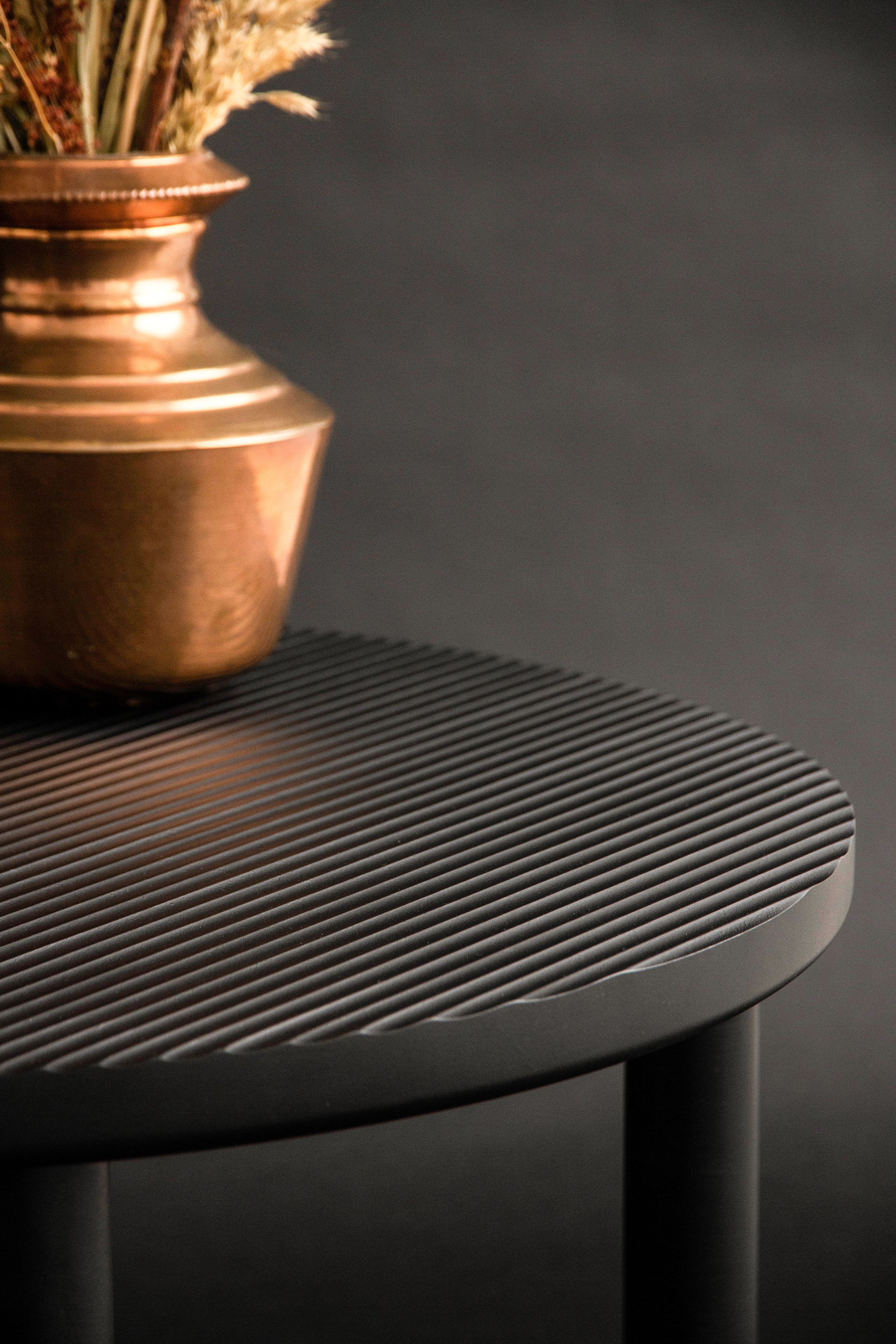 Fluted side table in black sycamore