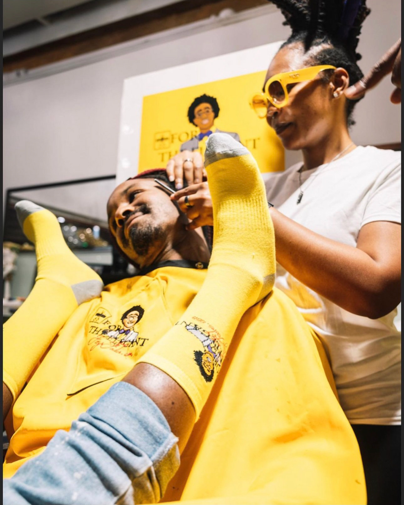 sock promo shoot for a barbershop owner