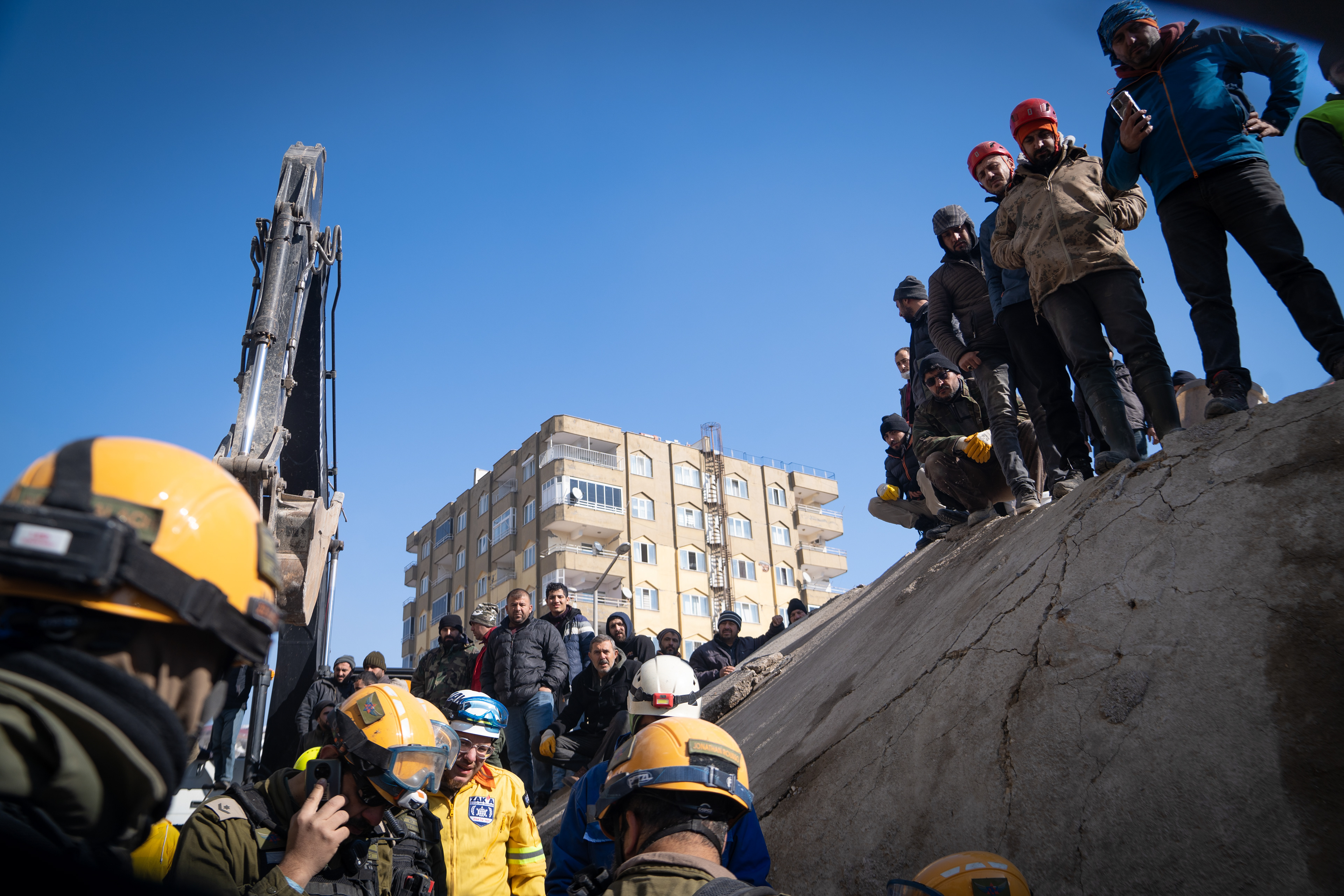 Citizens watching a rescue in progress.