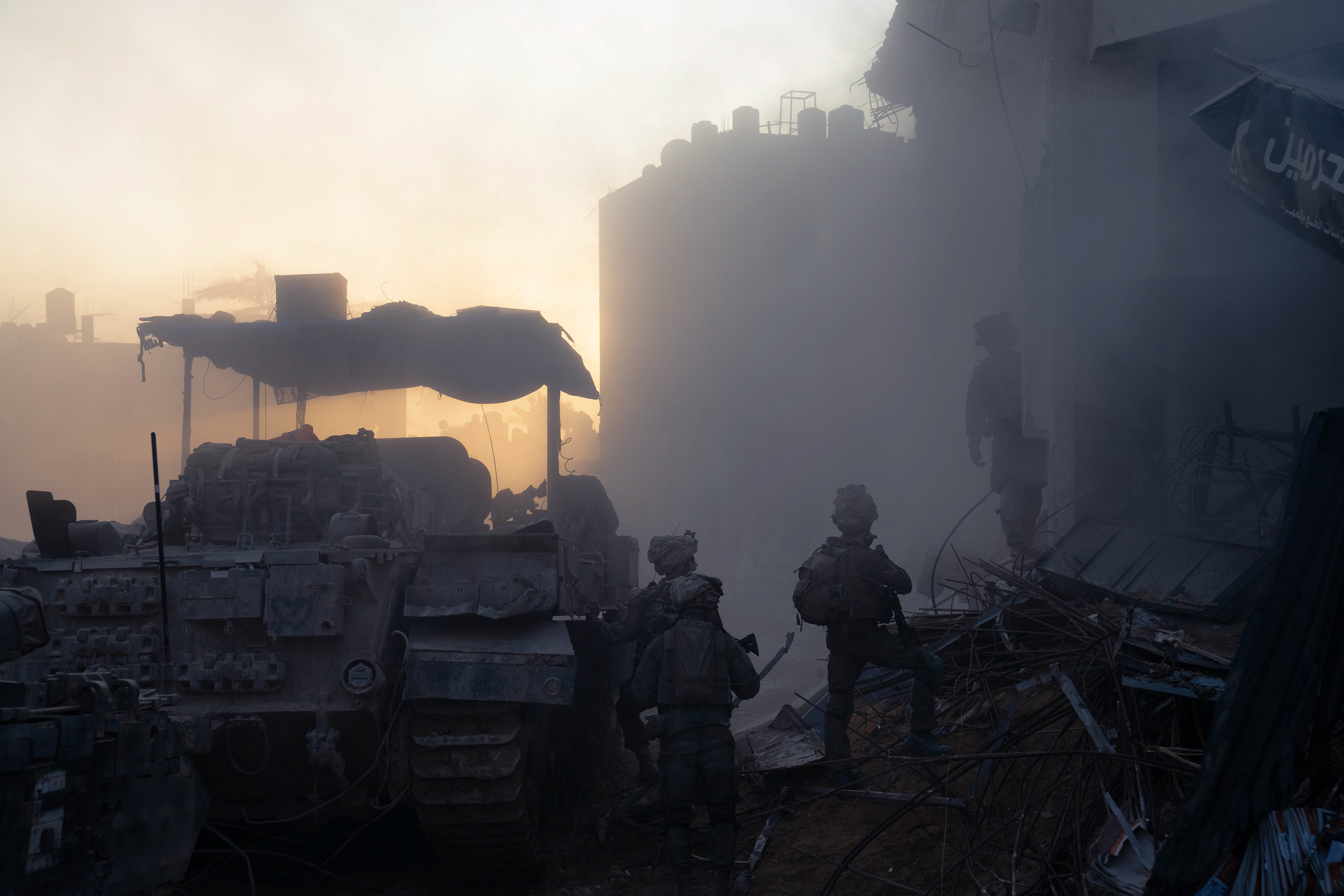 Dust settles after a building demolition in Khan Younis.