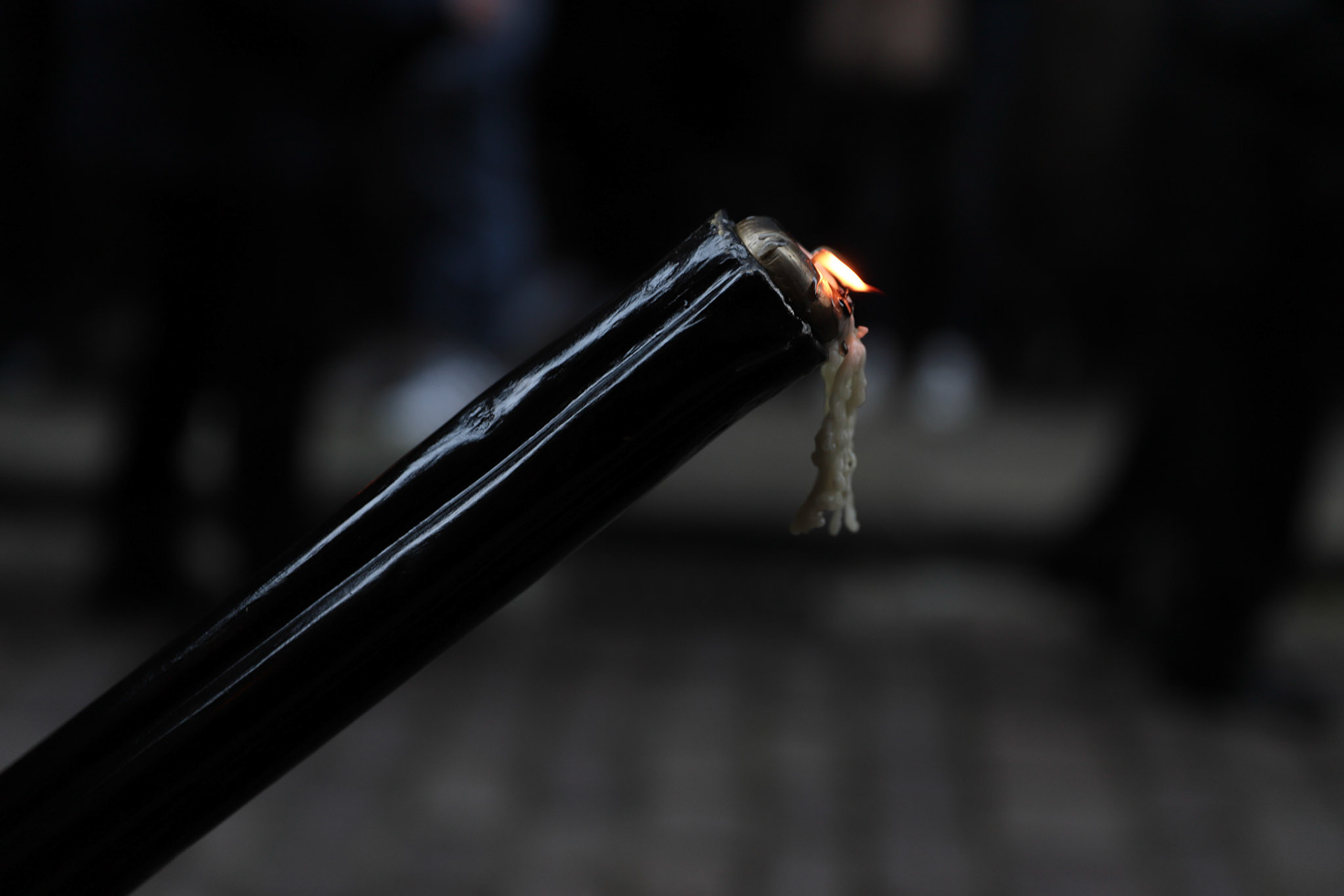 The wax from a black candle drips down as the Silent Procession and Holy Sepulchre of the Recumbent Christ takes place on Good Friday in Hondarribia, Gipuzkoa, Basque Country, Spain, April 04, 2023.