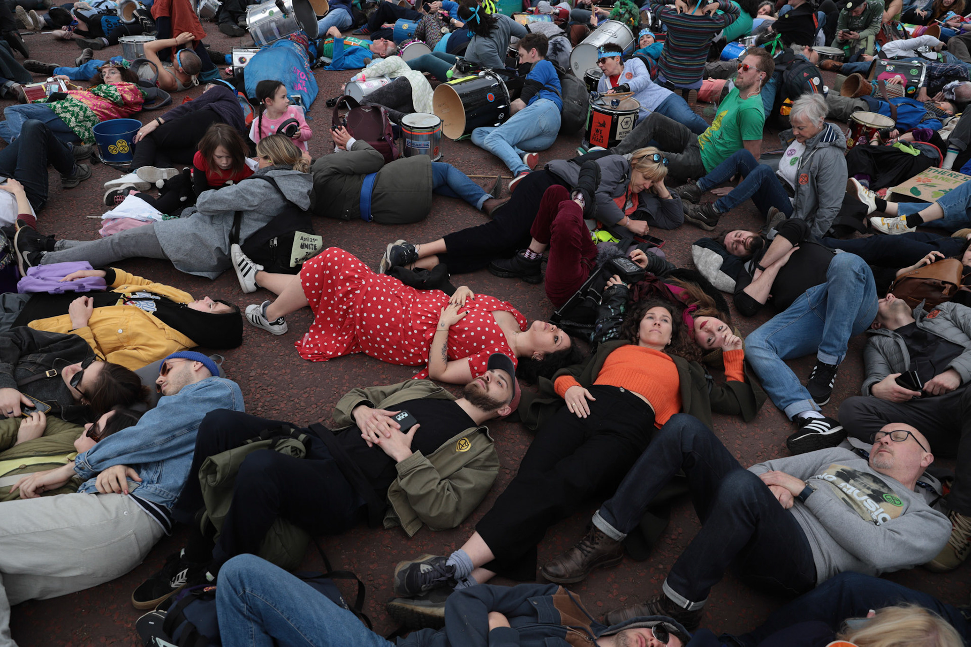 People participate in a staged 'die-in' during 'The Big One' protest and march organized by Extinction Rebellion in Central London, Britain, April 22, 2023.
