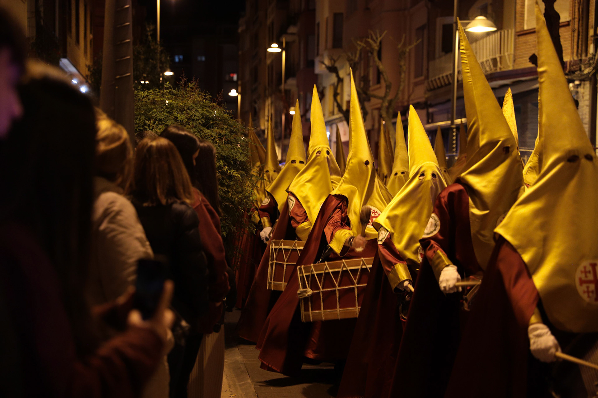 Members of the Flagellation Brotherhood play music as they march with the Penitential 'Via Crucis' of the Flagellation procession as spectators watch in Logrono, La Rioja, Spain, April 04, 2023.