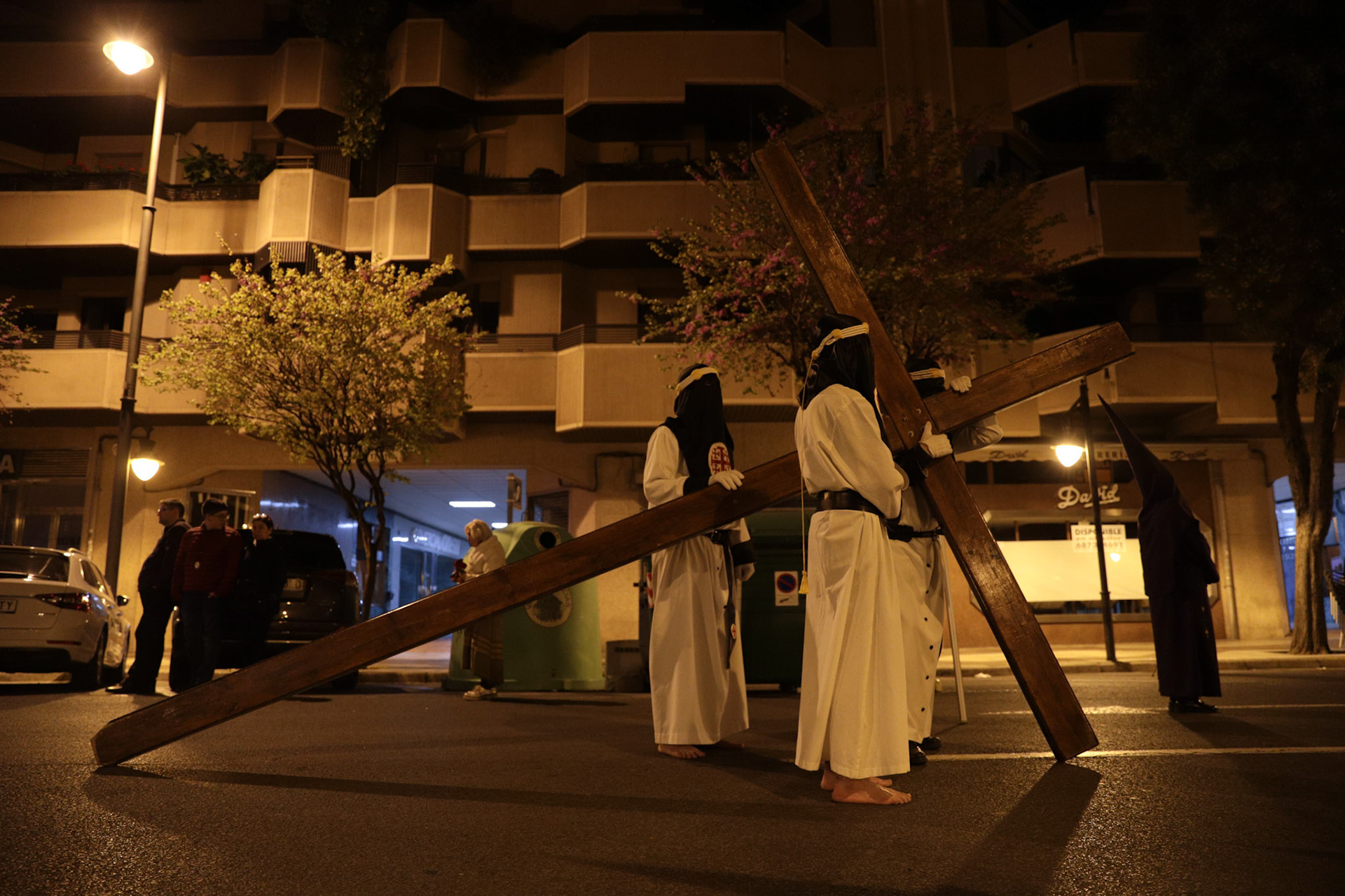 Members of the Flagellation Brotherhood carry a cross as they await their queue to start walkin the Penitential 'Via Crucis' of the Flagellation procession on Holy Tuesday in Logrono, La Rioja, Spain, April 04, 2023.