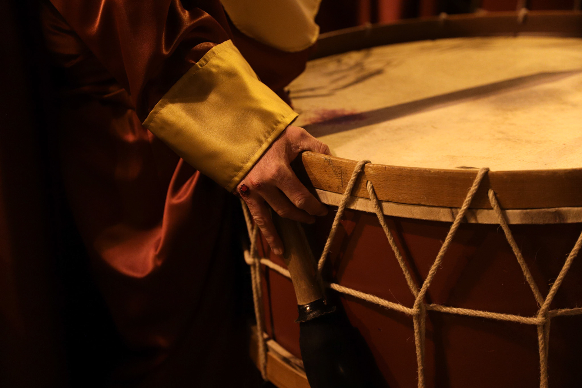 Blood is seen on the drum and fingers of a Flagellation Brotherhood member while he awaits his queue to play, as they march with the Penitential 'Via Crucis' of the Flagellation procession on Holy Tuesday in Logrono, La Rioja, Spain, April 04, 2023.