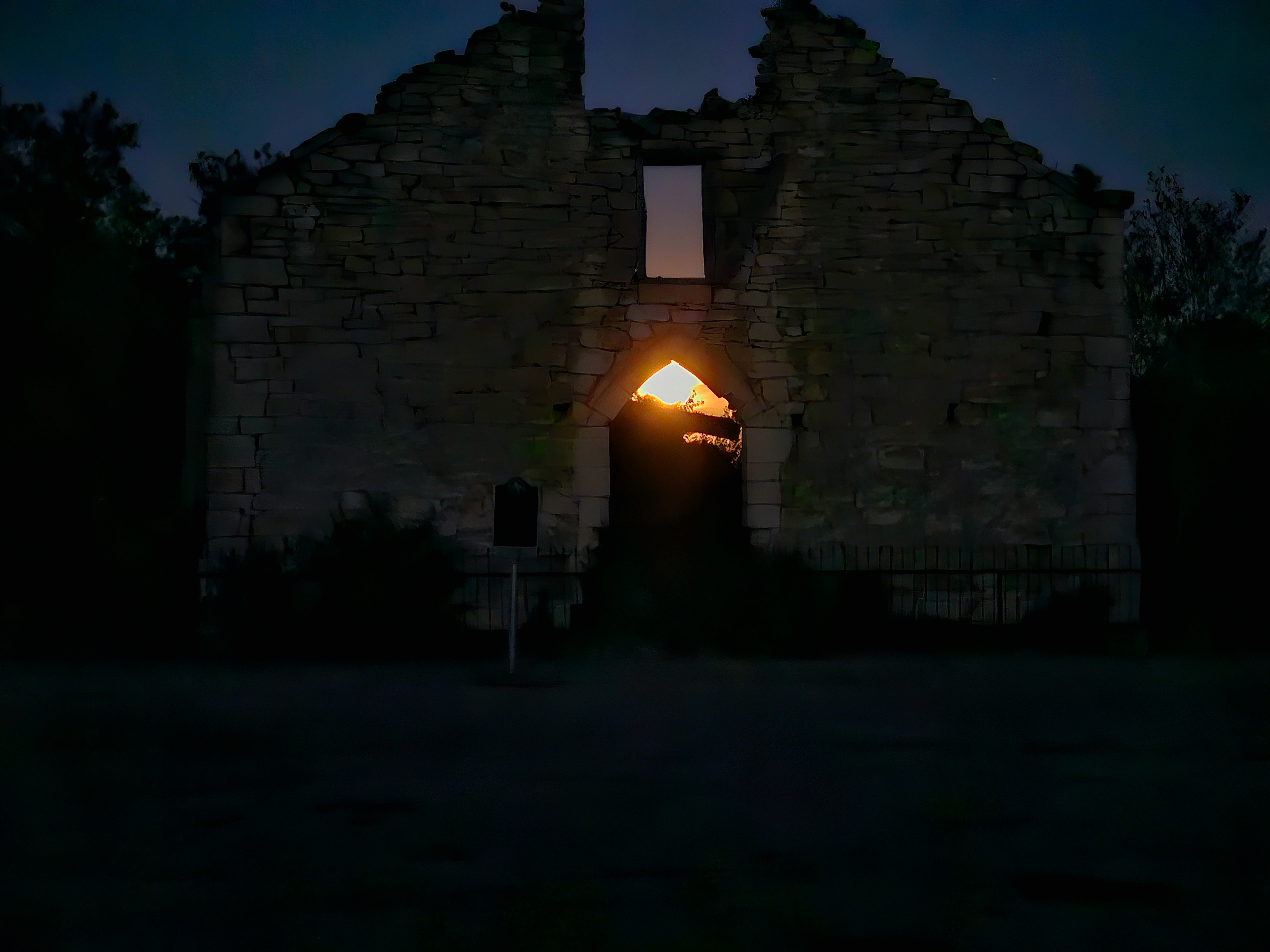Supermoon rising through church ruins