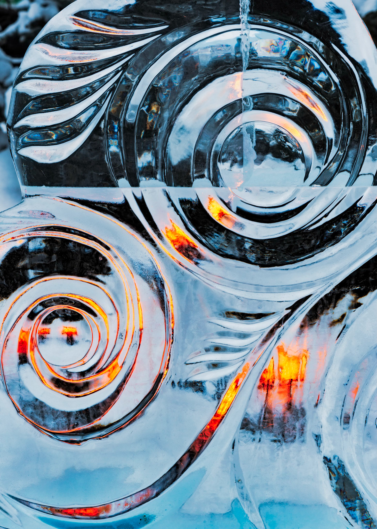 This is a tiny detail of a very large sculpture, where I've concentrated on the swirls enhanced by the coloured lighting.