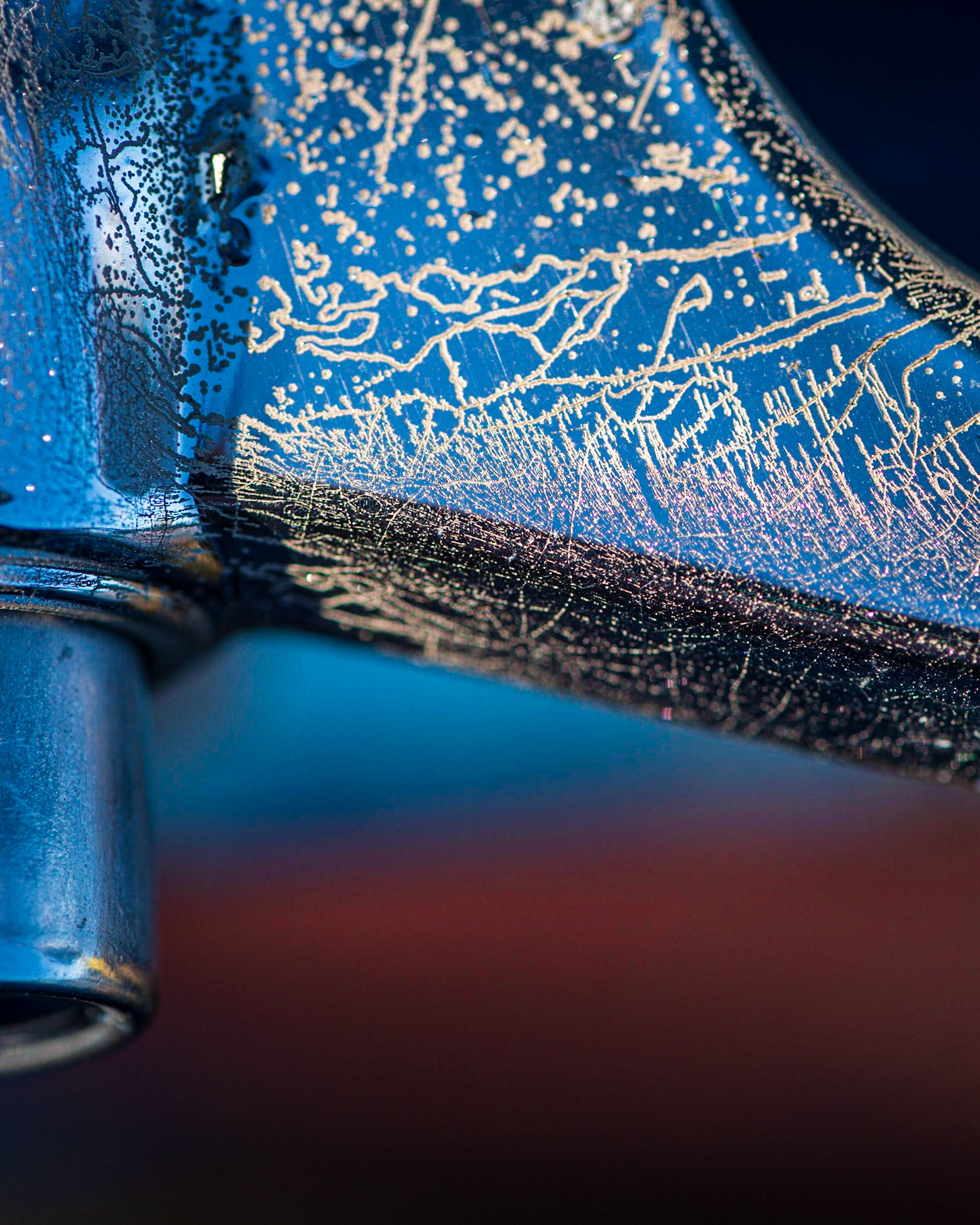 I saw the wonderful texture in the car handle and explored several compositions. I think the band of red at the bottom that reflects into some of the texture adds some extra interest.