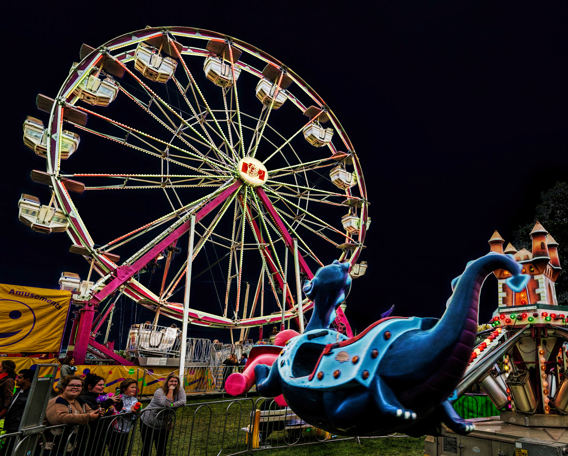 This is a playful shot, both from the framing of the dragon leaping towards the ferris wheel, and in the post processing
