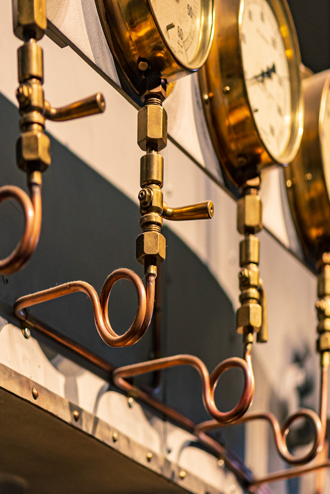 This is a small part of a steamboat engine. I included the dials to give a hint of what this is, but I was interested in the shape of the copper tubing and the repeating pattern of shapes.
