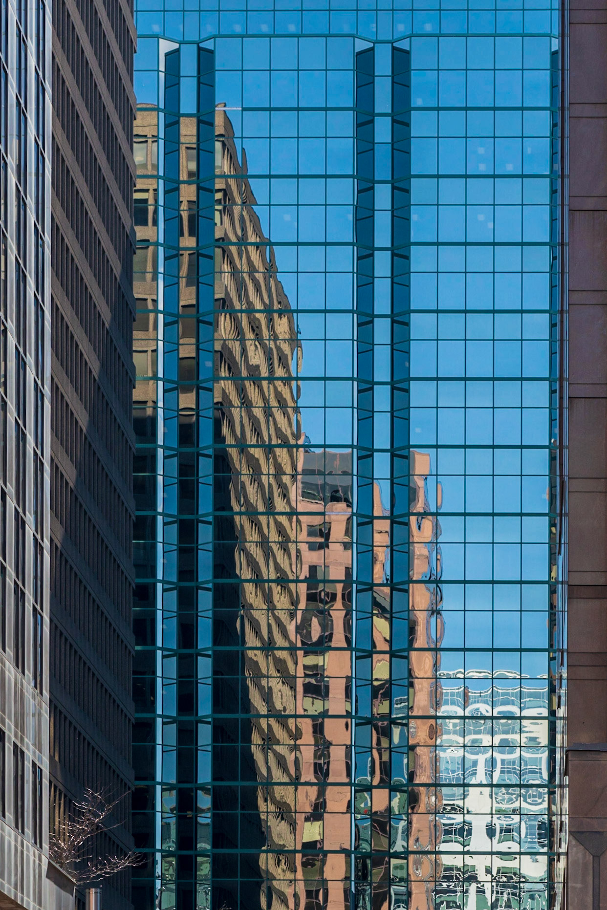 A fairly conventional shot of a row of buildings reflected in another building. There are several strong verticals in this composition that I’ve tried to arrange in a pleasing manner.