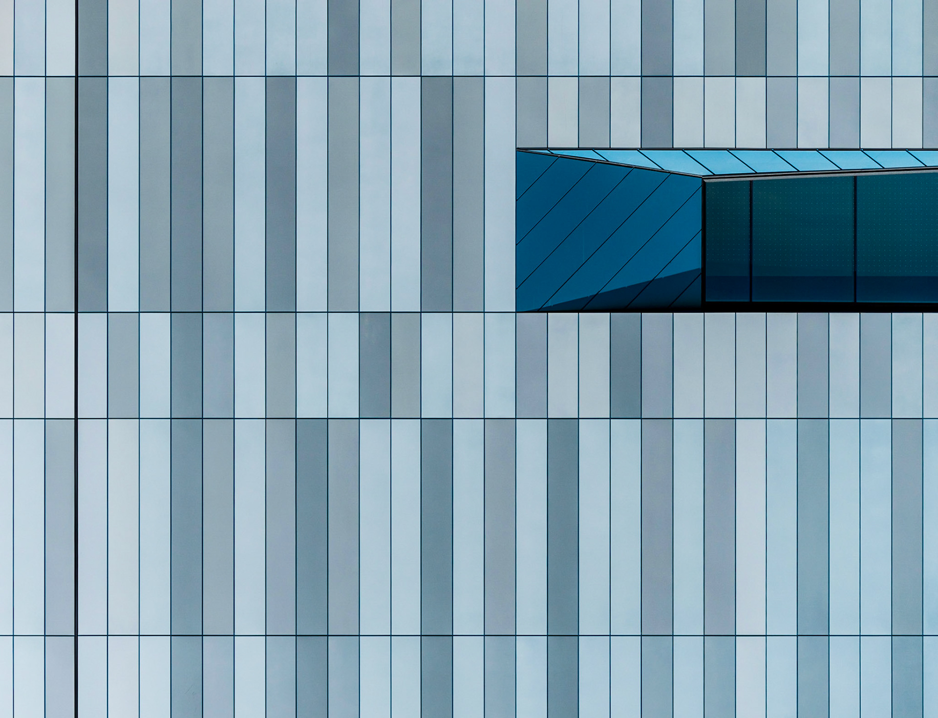 This shot of the building next to the museum has been abstracted to one of pure geometry. I’ve taken liberties to rotate and mirror-image the original shot to one that I find more aesthetically pleasing.