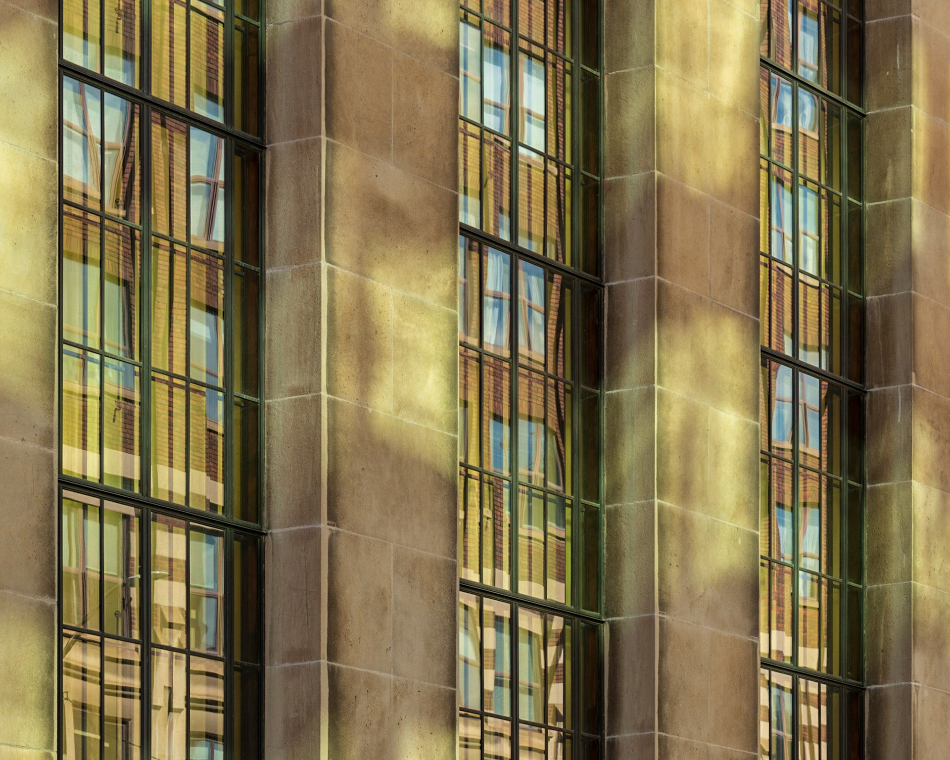 The amazing light reflected onto the side of this building is what drew me to this shot. Some work in post-processing was needed to correct for perspective distortion.