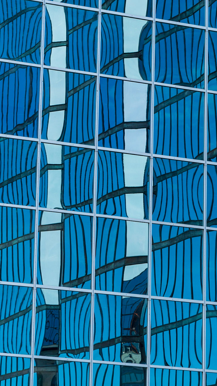 There are many reflections of one building in another, and these offer a myriad of interesting images. Here I was working with the arrangement of crossing white and black diagonal lines in the context of the two strong verticals.