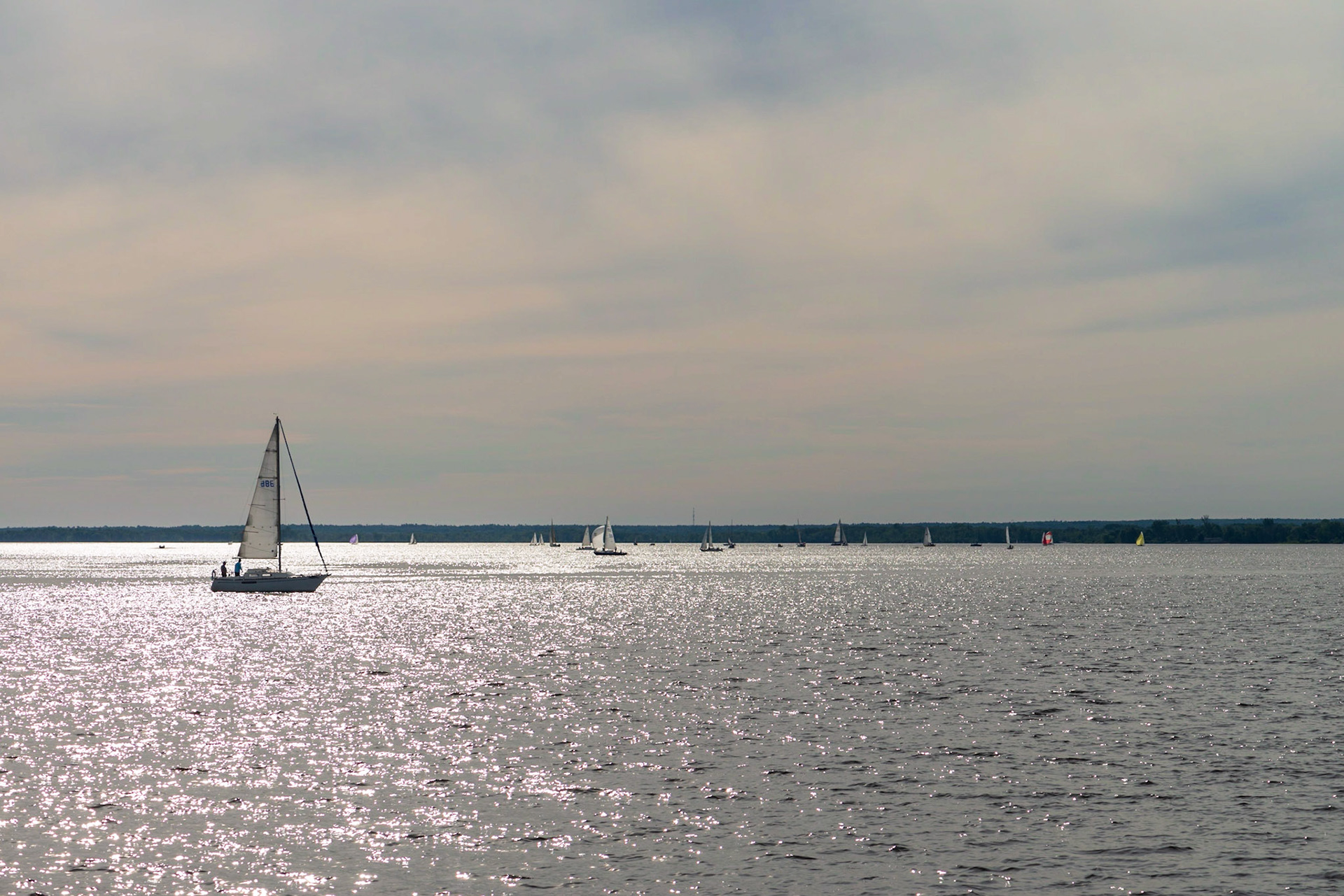 A setting sun and slight breeze combined to add glitter to the water, and a passing boat entered the perfect position for this shot.