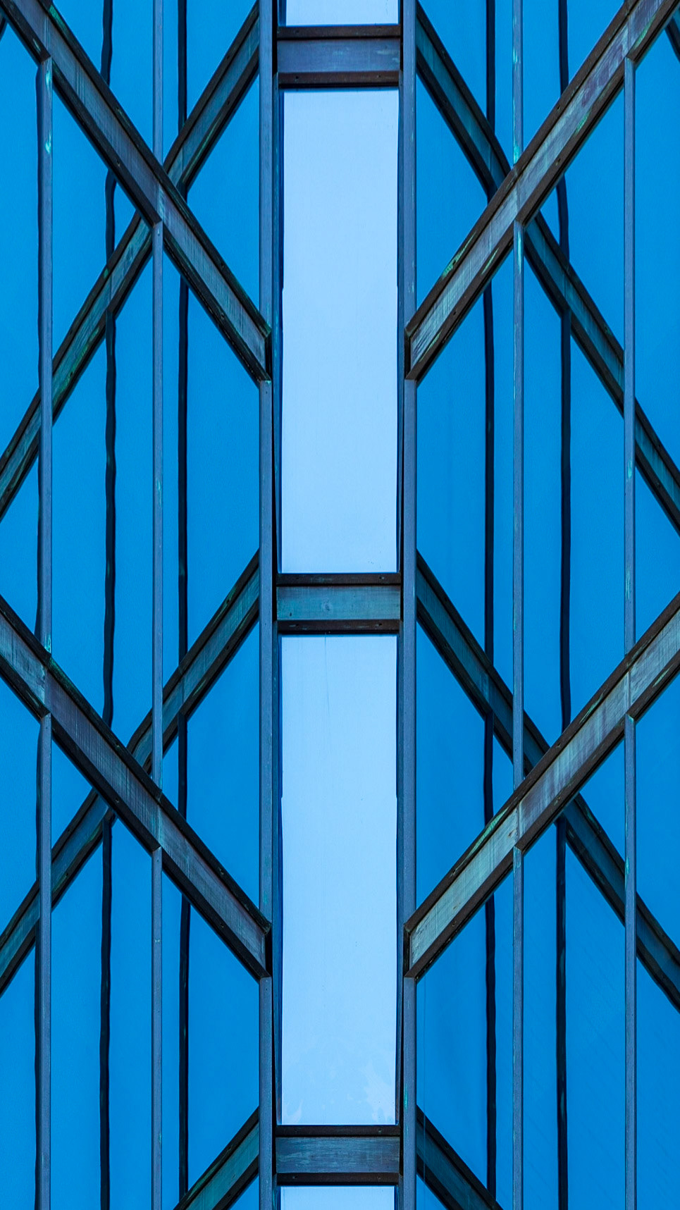 Purely a study of symmetry and lines on the side of a building. Since I needed to tilt the camera upwards to get the shot, work in post-processing was needed to correct the resulting perspective distortion.