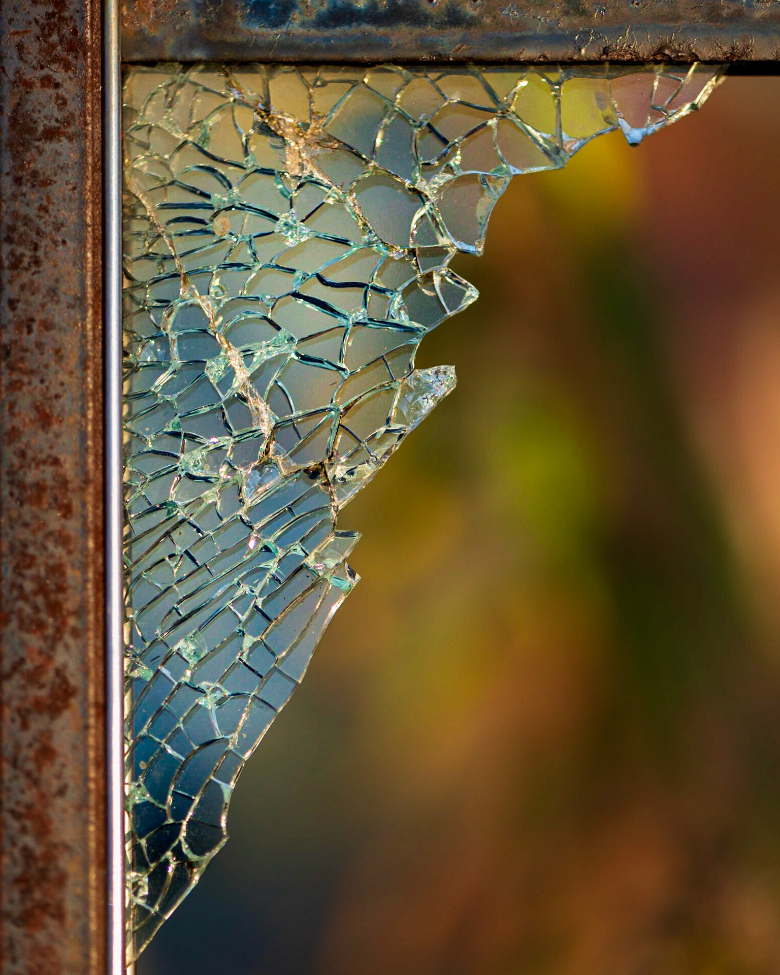 More broken glass (literally) framed with a colourful diffuse background. I enjoy the diagonal and the contrast of the sharp foreground and soft background.