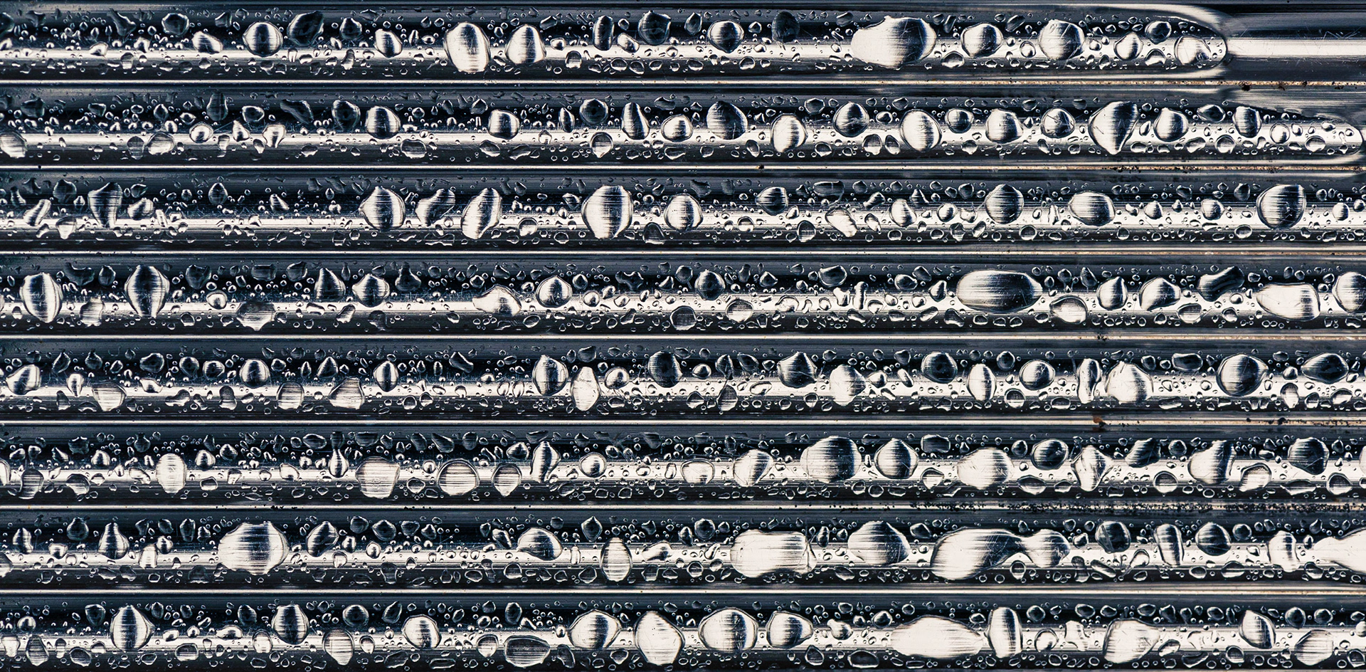 I love the textures and interesting shapes in this shot, which were entirely formed by the rain on a metal chair. I kept the shape in the upper right to increase the mystery of what this is.