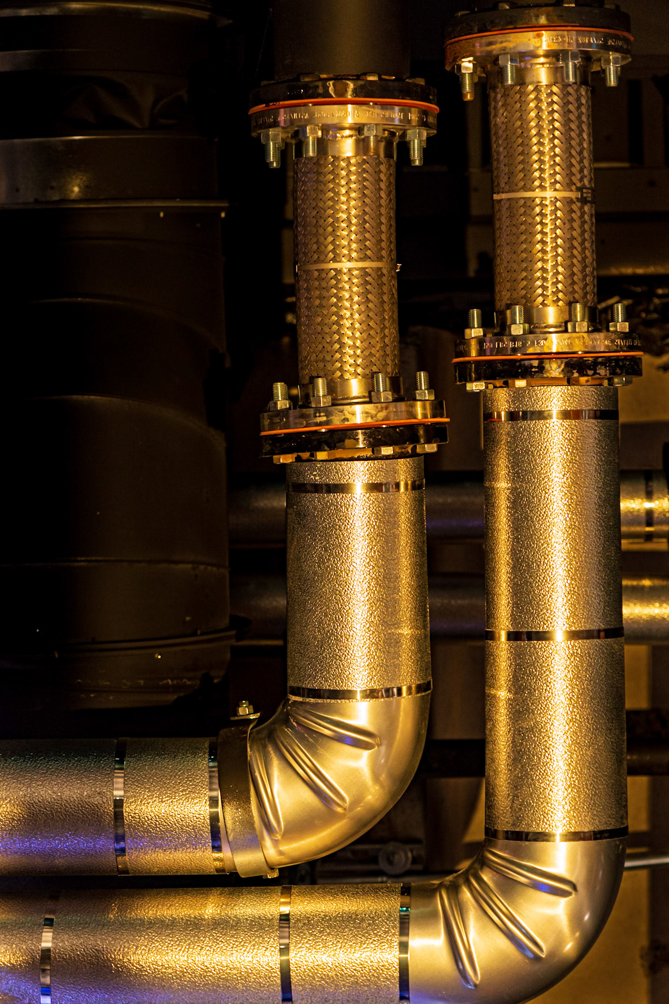 I try to look in all directions as I explore an area. In this case I spotted what I think are heating ducts in the ceiling that offered interesting shapes and were lit with a soft golden light by the museum displays.