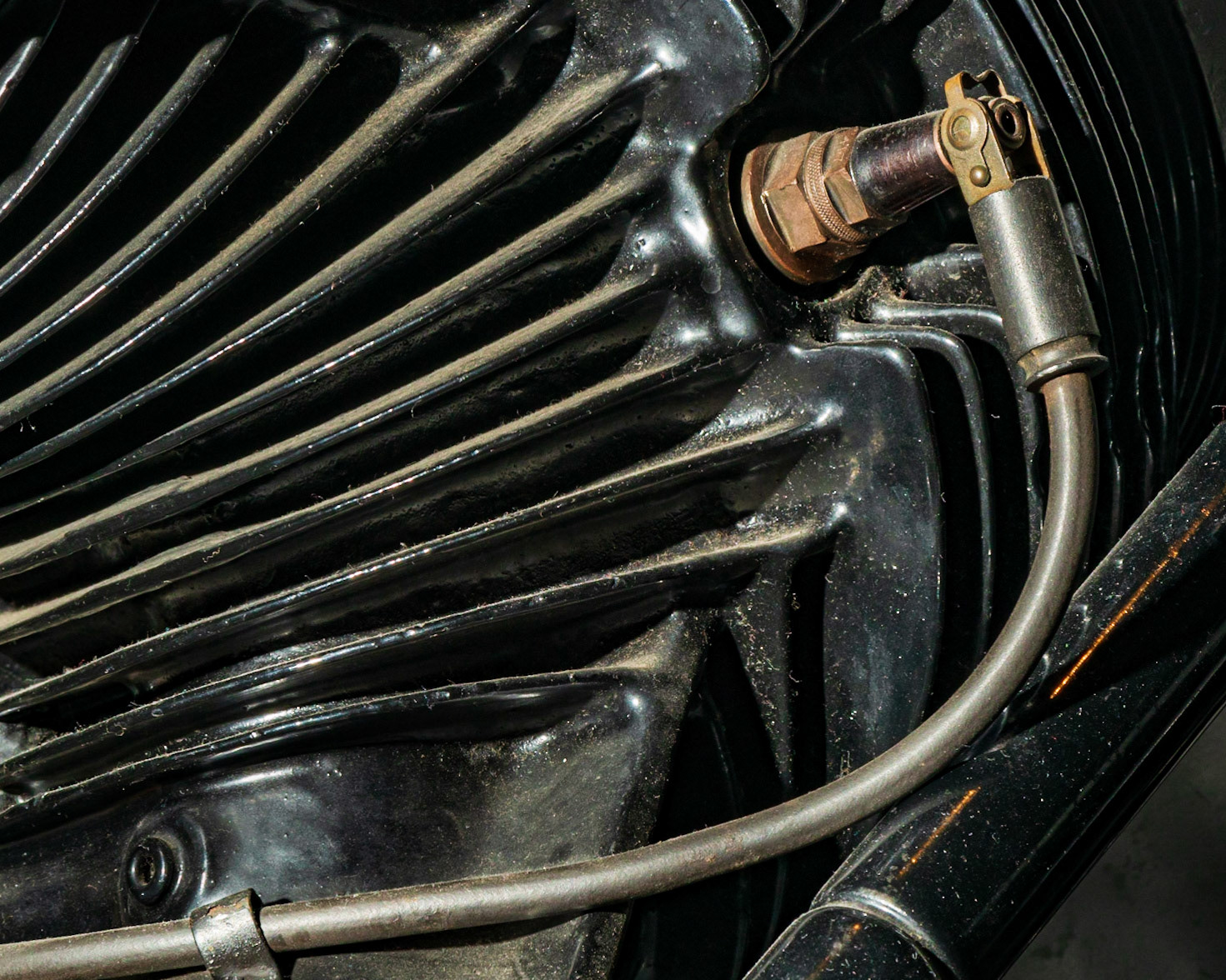 My flash was indispensable here to light this feature. The sweep of the cable and the fins on the housing lead our attention to the rust coloured assembly at the upper right.