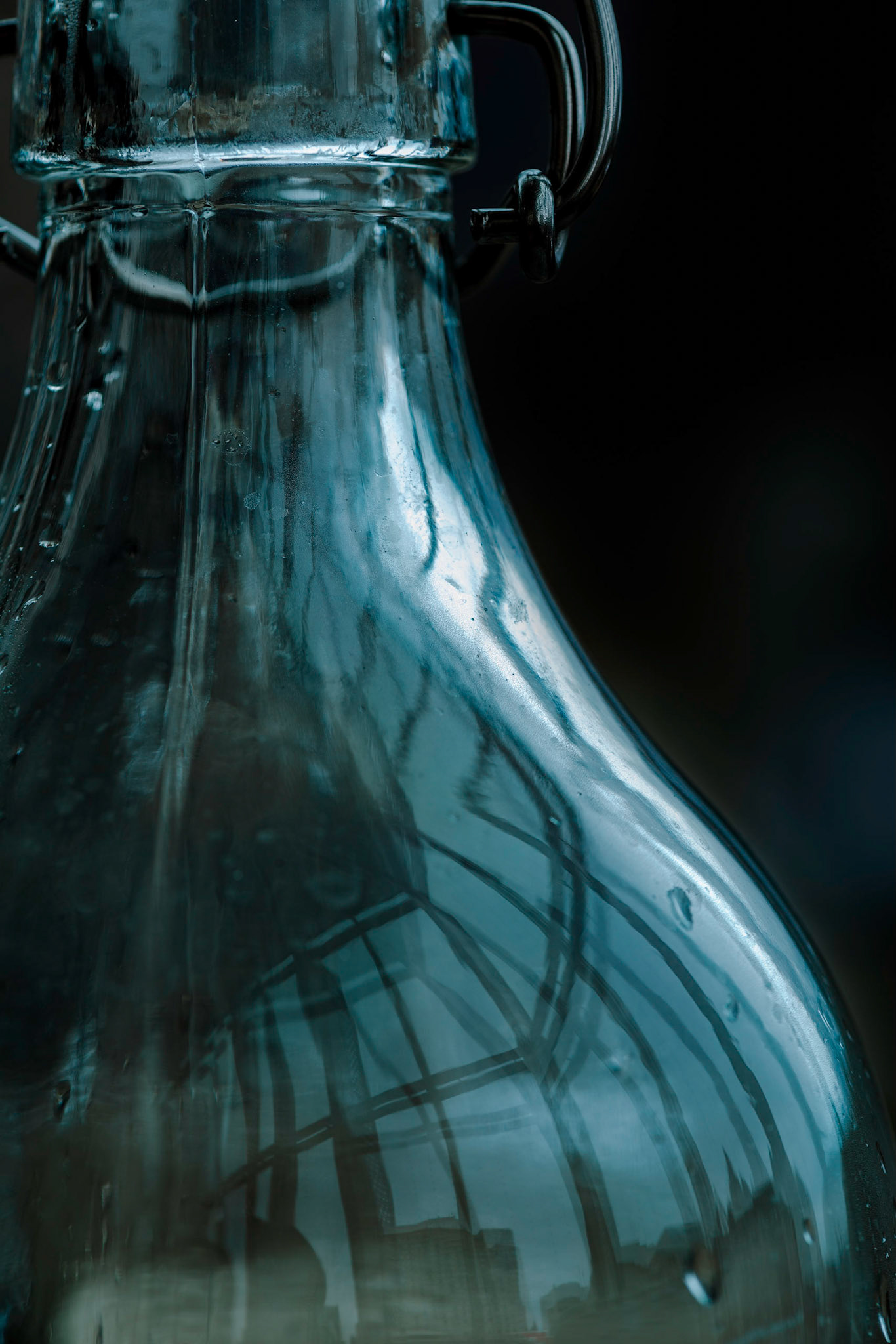 Here we see a juxtaposition of the familiar (a bottle) with an unfamiliar (the reflection).