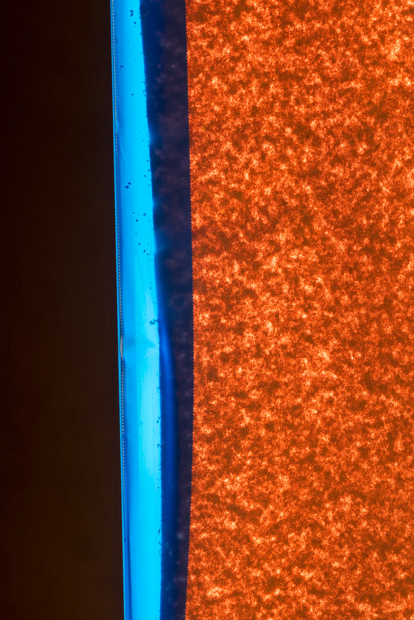 I'm sure passers by thought I was crazy to photograph paper held in place by blue translucent tape in a construction area, but look at the intense colour created by the sunlight.