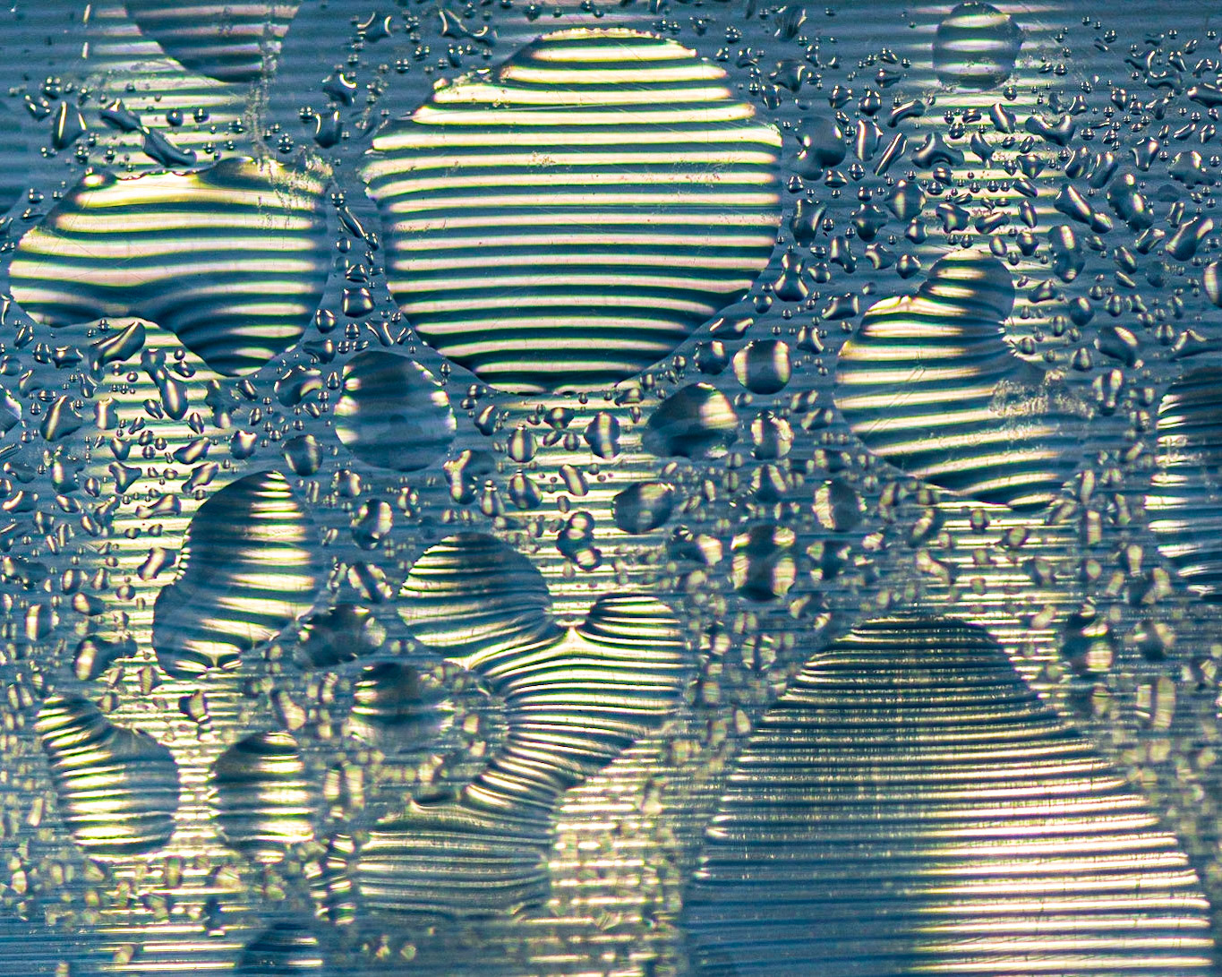 There was an art installation on Sparks Street called Impulse (lighted seesaws with light and sound). With rain drops on their surface, many abstract patterns were on view for the observant photographer.