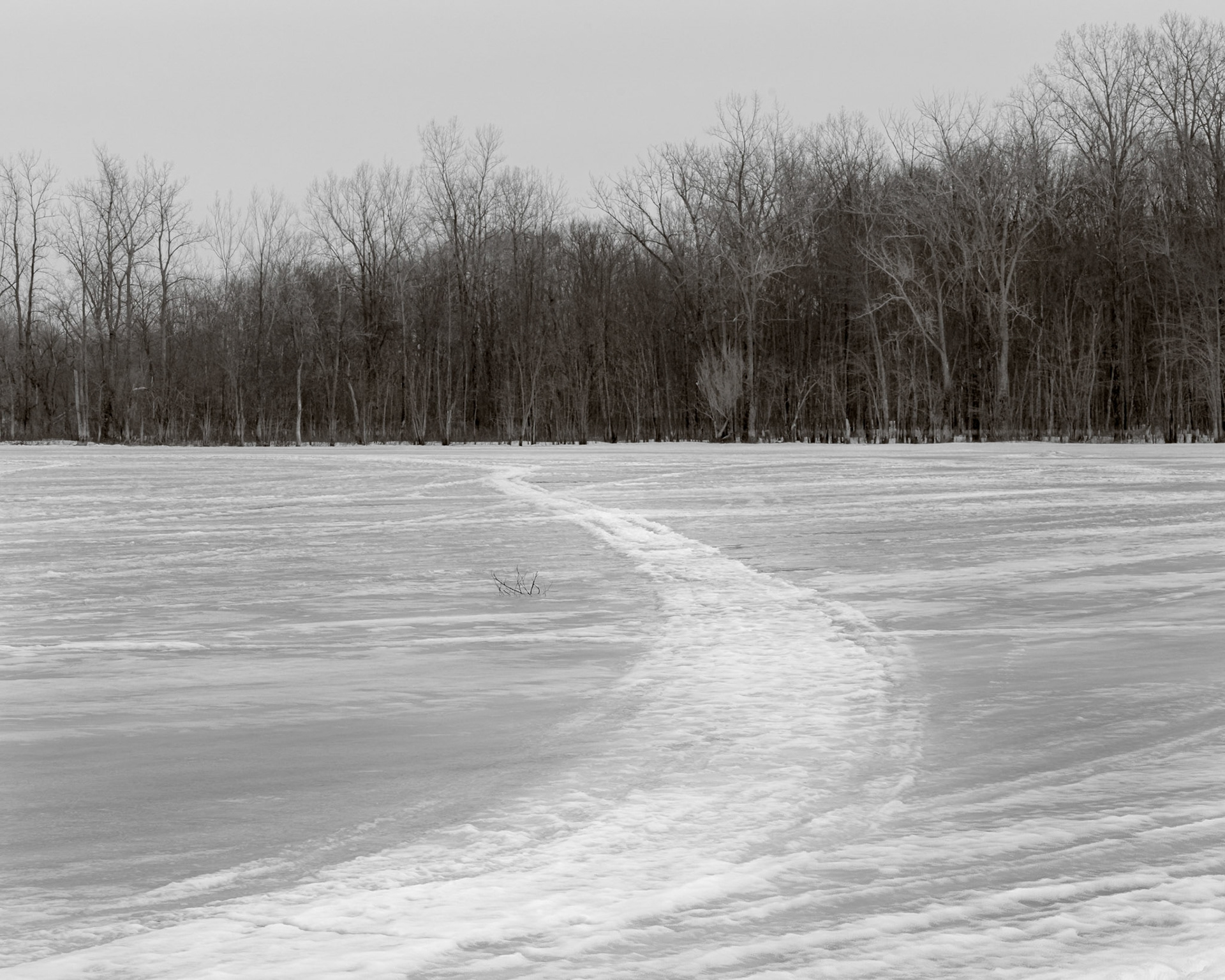 This shortcut across the ice from the opposite shore shows heavy use. But I doubt that it's safe this late in the season.