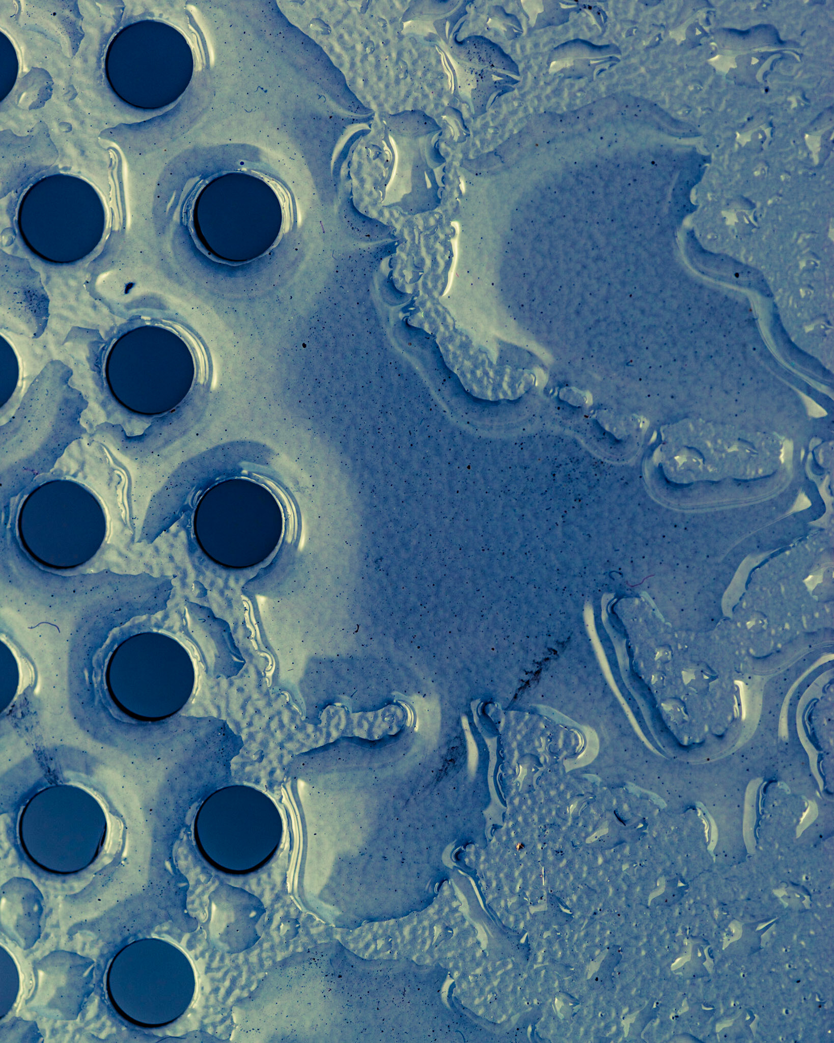 Blair Station. Metal chairs at the station and some earlier rain provided the raw material for this shot. I just need to look around and see the possibility.