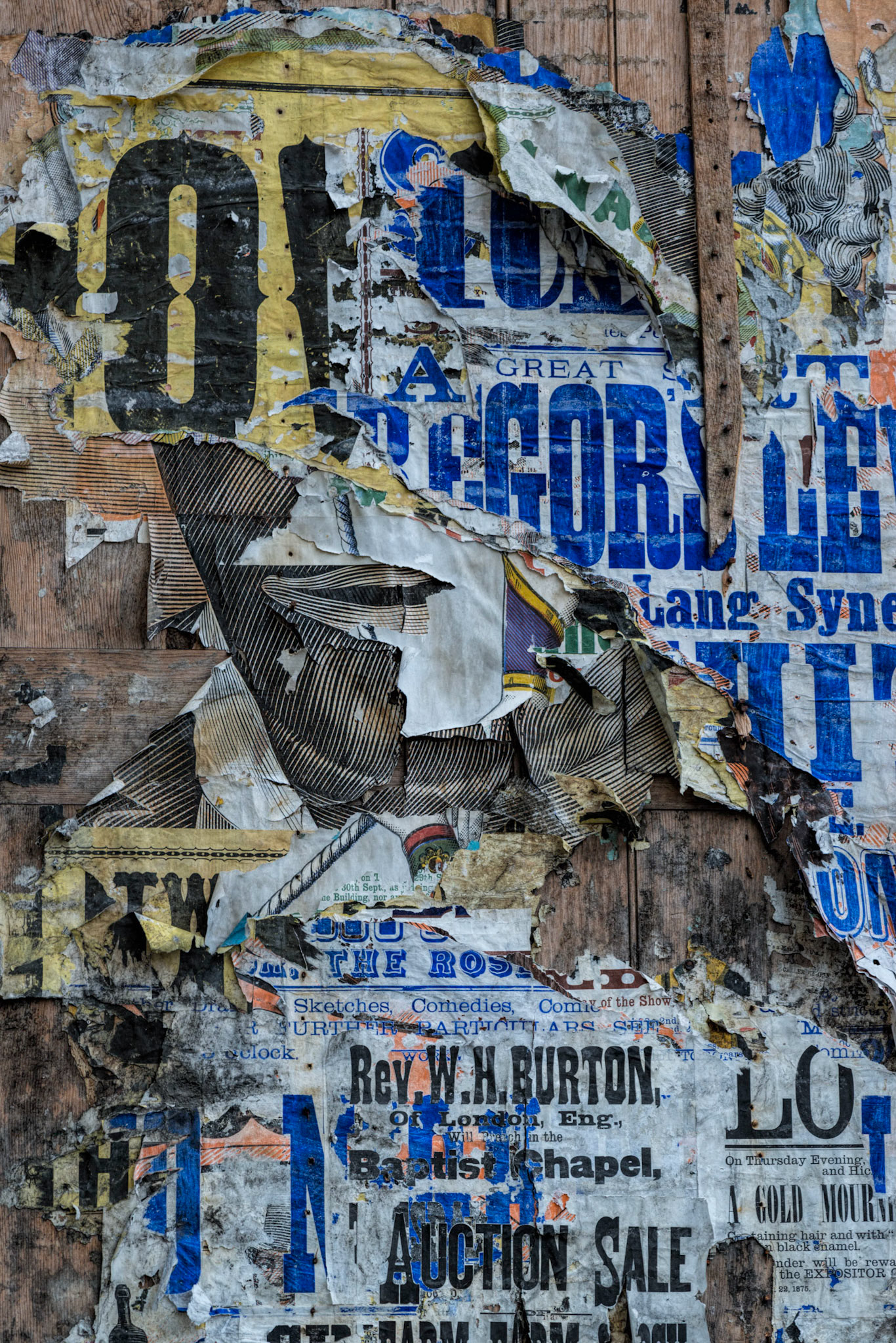 Multiple posters and the passage of time combined to assemble a compelling image; I merely recorded it.