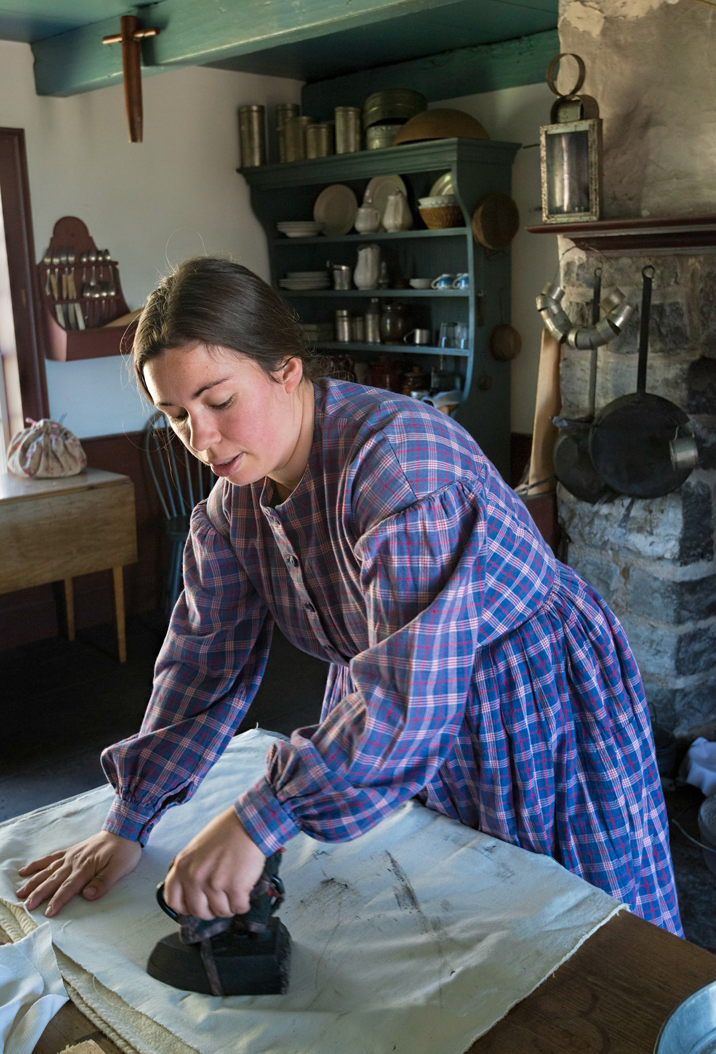 Several homesteads are portrayed at Upper Canada Village. In this case the reenactor is playing the role of a farmer's wife and doing her chores.