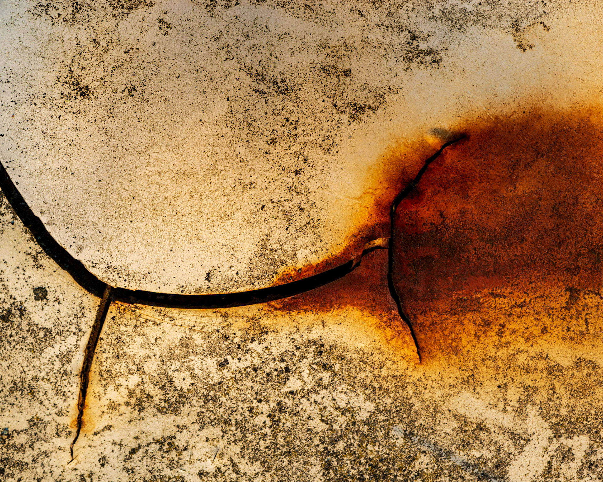 A crack leading to rust on the side of a dumpster. I find this rotated view more interesting and natural since most viewers are indoctrinated to look from left to right.