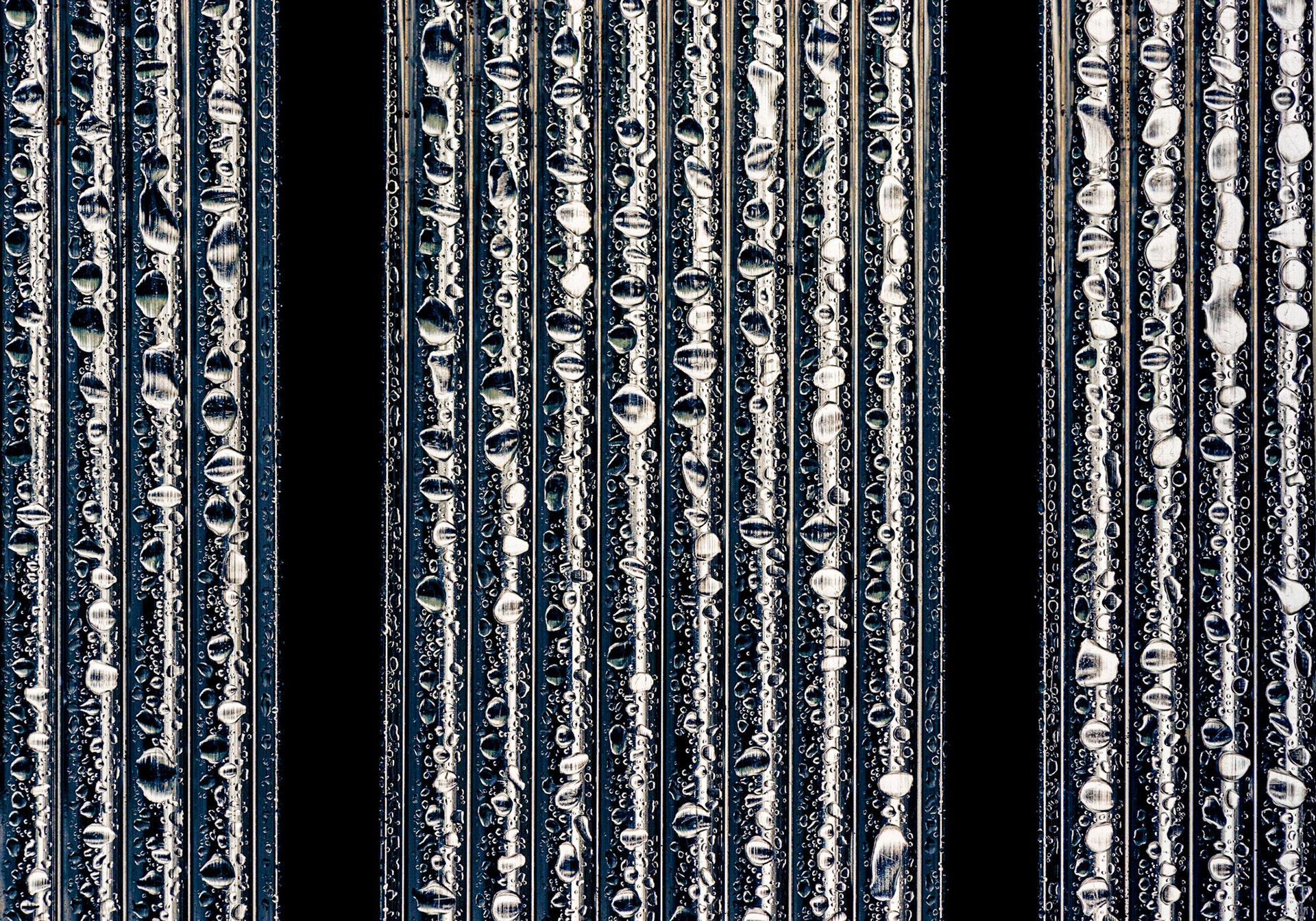 Here is another shot of rain droplets on a metal chair, but in this case, I framed the shot as if it was a triptych.