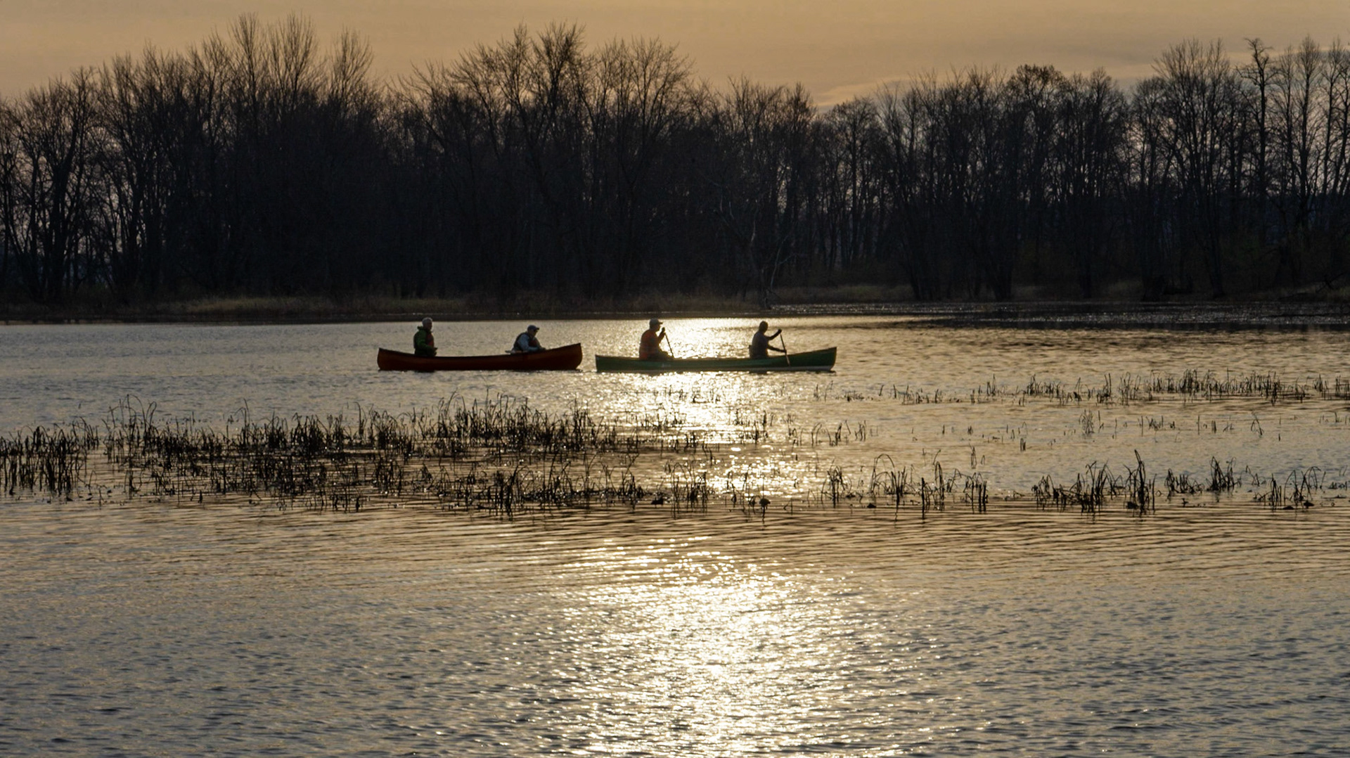 Canoes in twilight. I waited patiently for this alignment, although I took a few shots before and after as well.