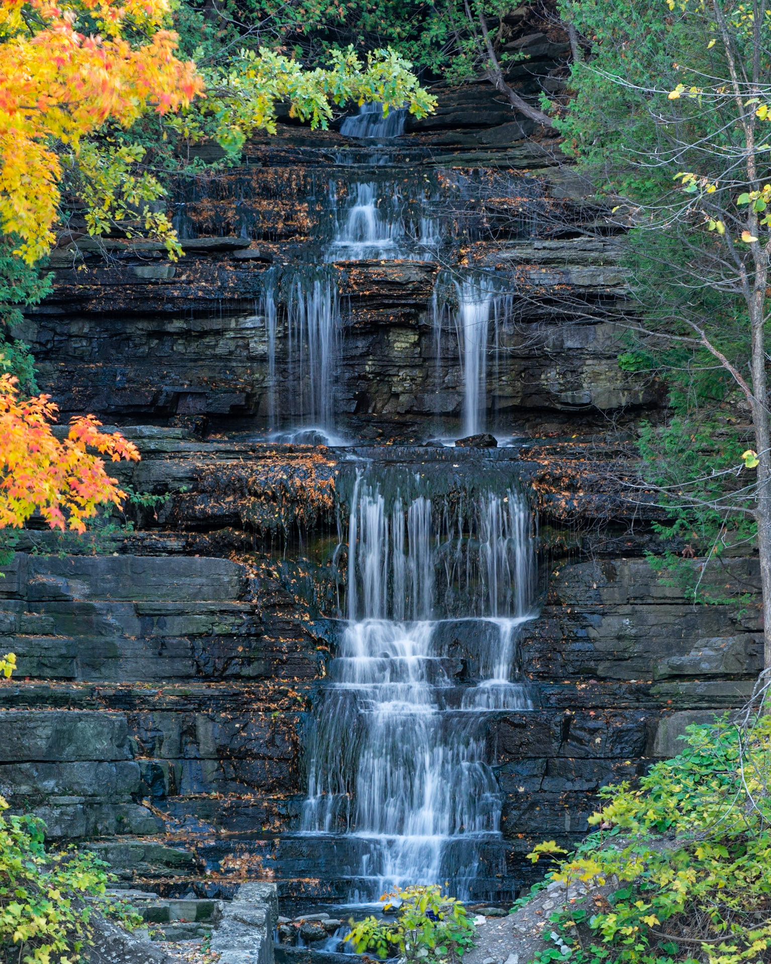 The Princess Louise Falls as shot from the sidewalk along St. Joseph Blvd. Part of an old structure is just visible at the bottom of the frame.