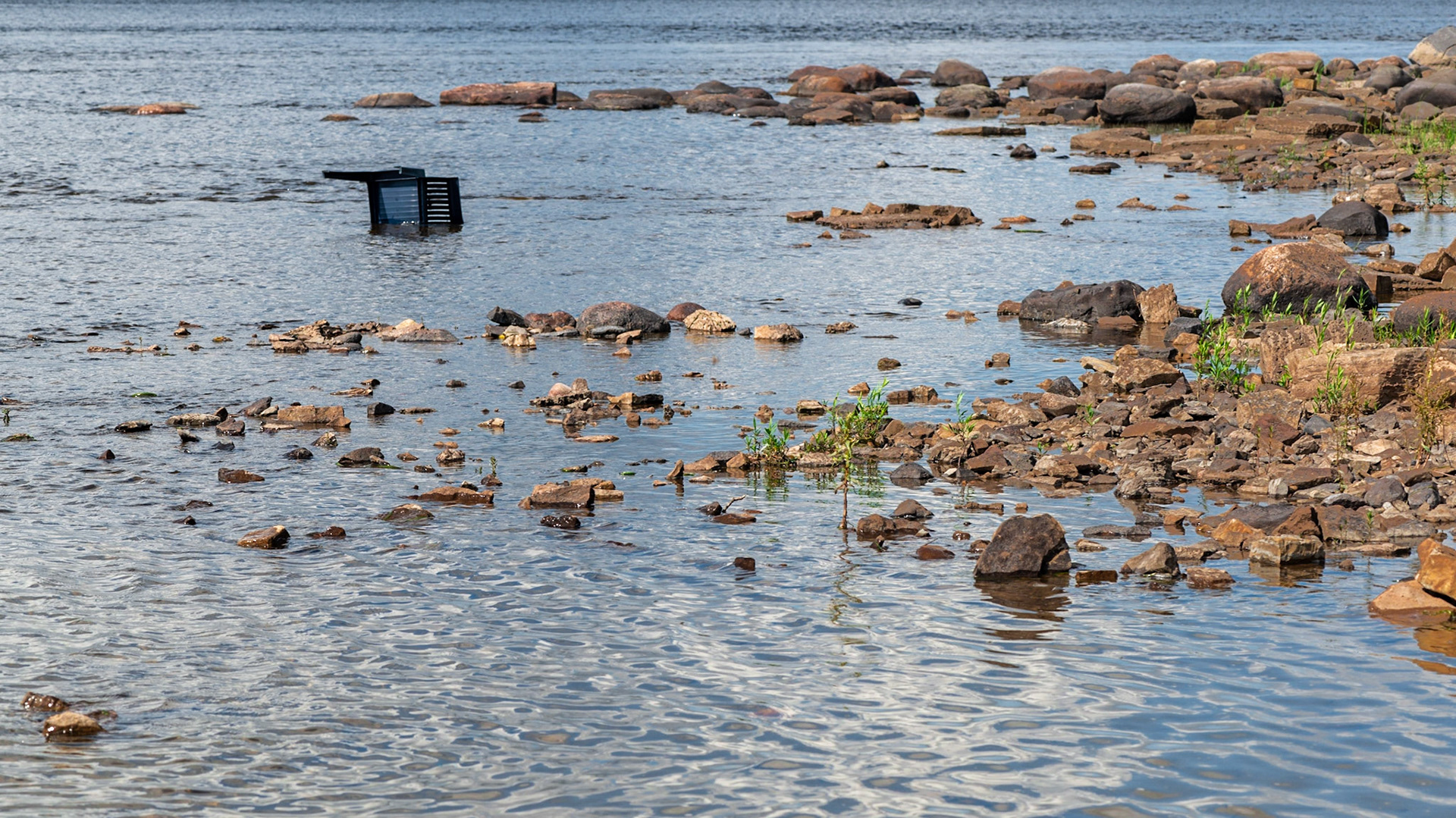 Another found object, most likely tossed there as a prank. I chose the framing to position the chair within the two lines of rocks - a frame within a frame.