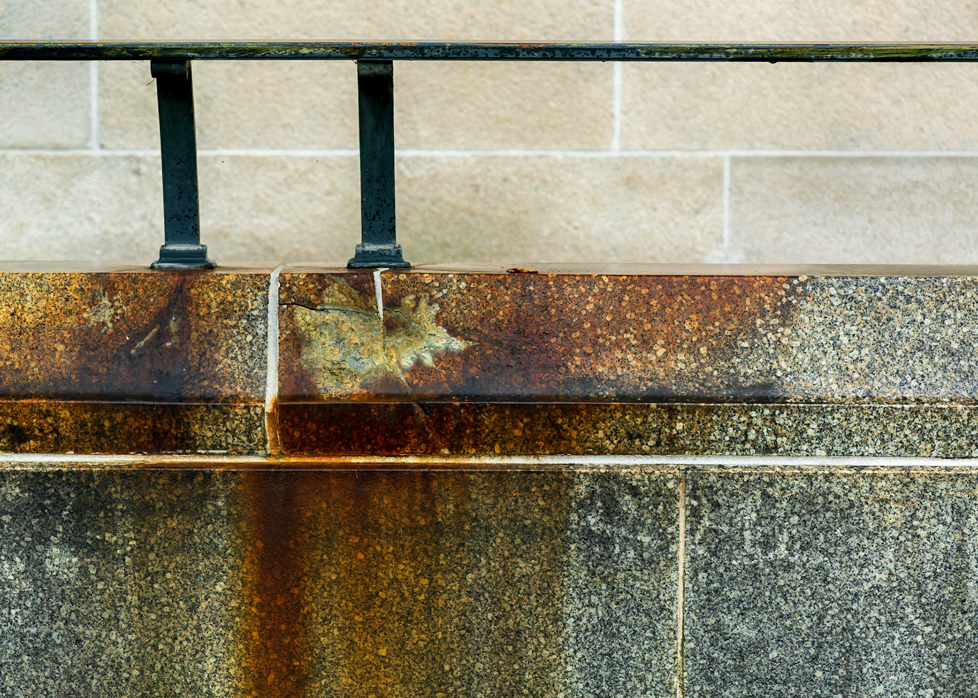 Horizontal and vertical lines create a static stage on which we have a rusty area of colour and an interesting leaf-like shape to attract the eye.