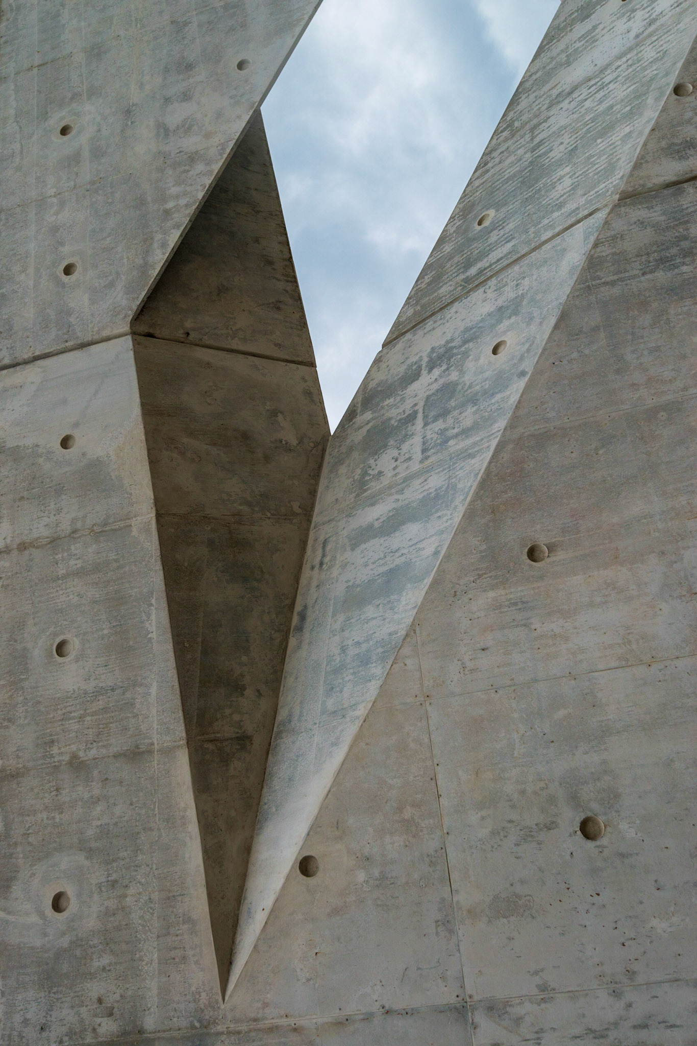 Diagonal trapazoidal shapes. The amount of sky was chosen to balance the composition with the predominant concrete.