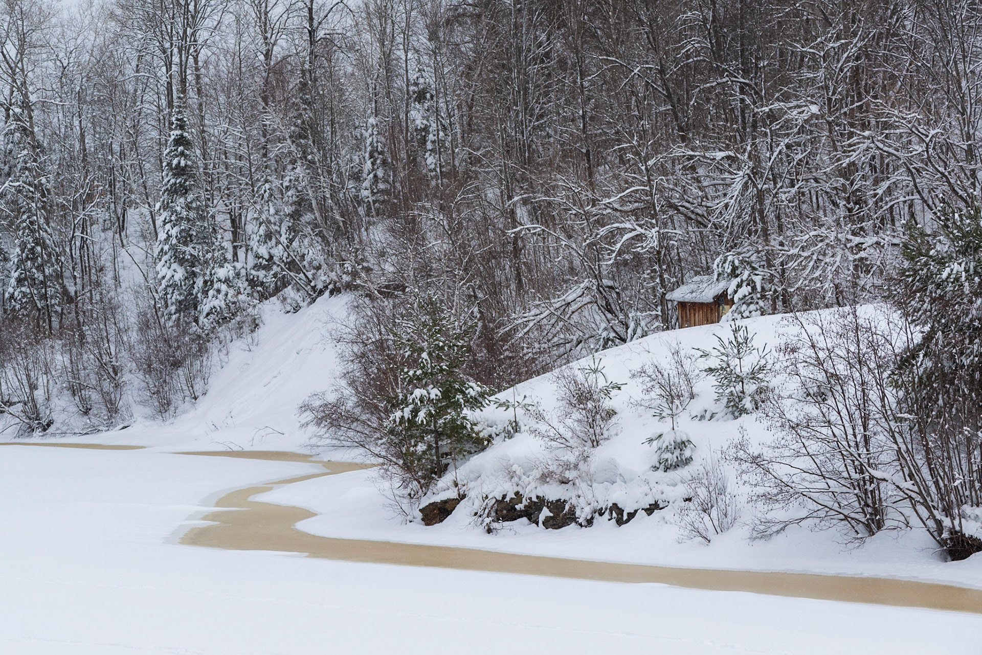 Walking back, there was a third observation platform from which this shot was taken. It was composed to visually balance the building with the S-shaped patch of bare ice on the lake.