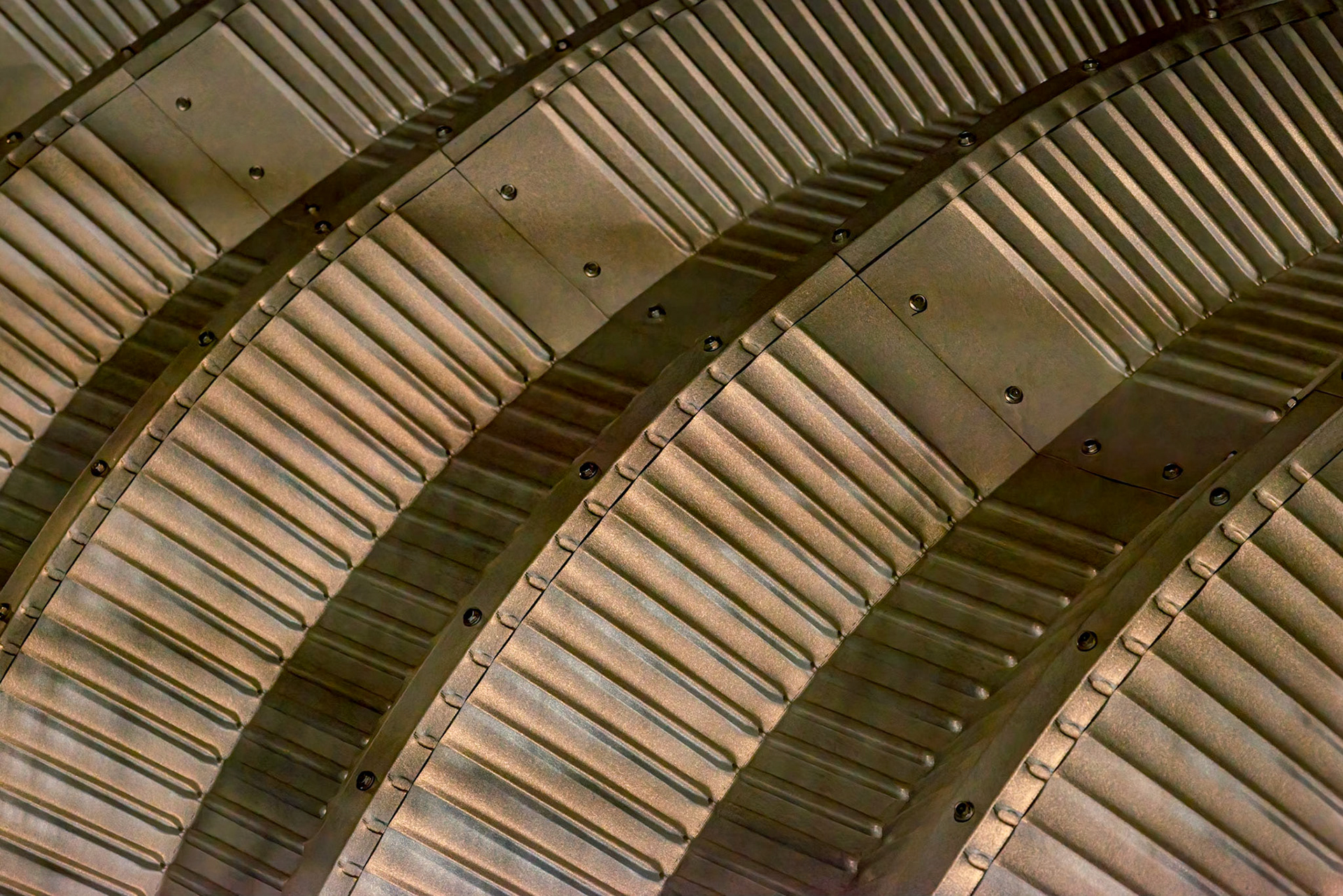 Arcs in the roof of a storage shed. [ISO 12800, 105 mm, f/8.0, 1/100s]