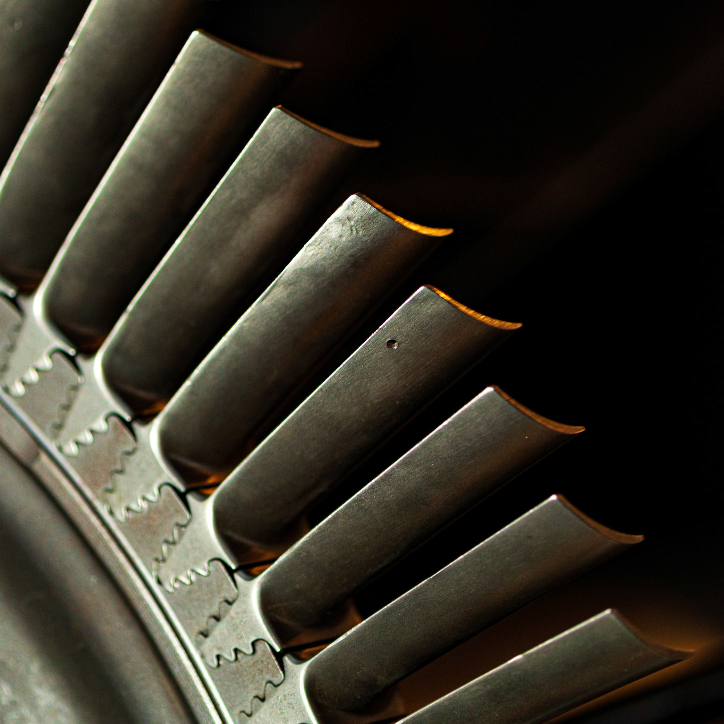 I was drawn to the arc of the turbine blades and positioned my flash to illuminate them from the left. Warm museum light is coming from above and highlighting the edges of the blades.